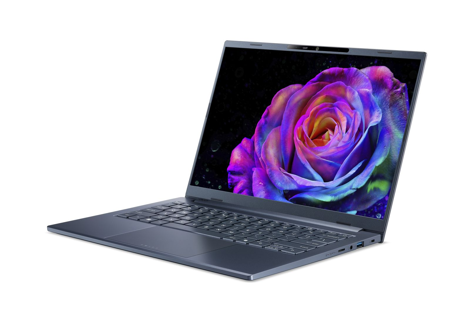 Ein grauer Laptop ist auf einer weißen Oberfläche geöffnet und zeigt eine bunte Rose auf dem Bildschirm.