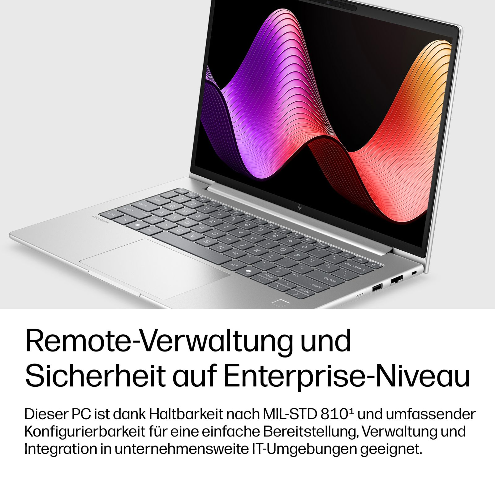 Silberner Laptop mit abstrakten Farben auf dem Bildschirm und deutschem Text.
