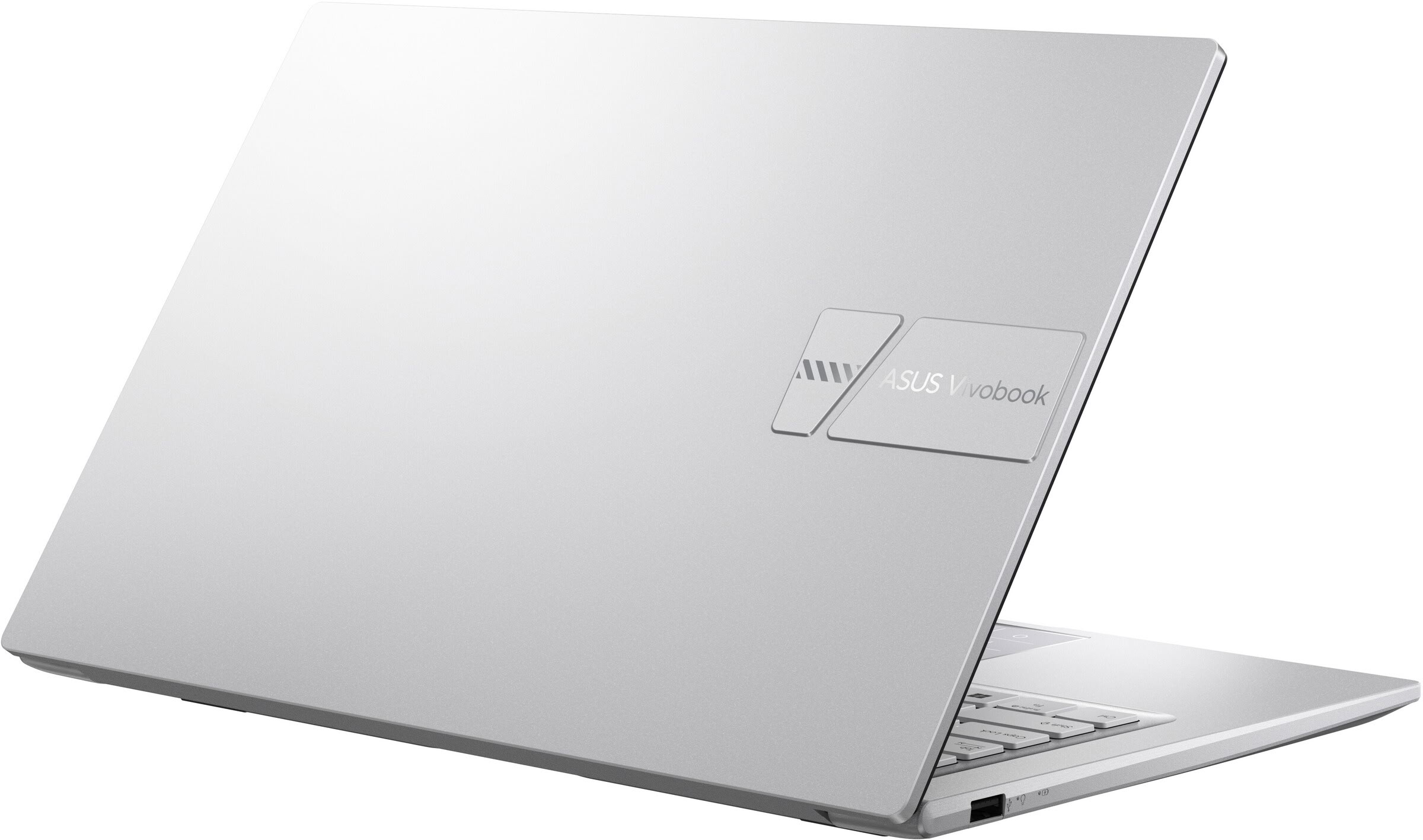 Una laptop ASUS Vivobook plateada con logotipo en la tapa cerrada, sobre un fondo blanco.