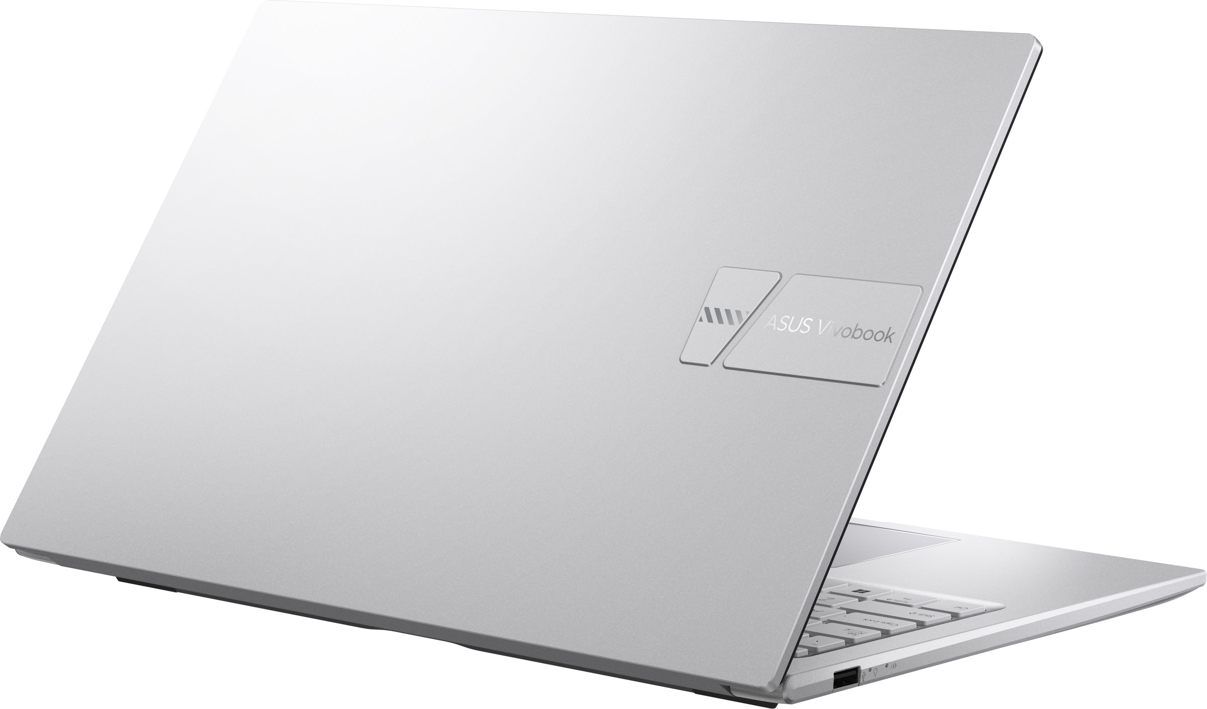 Un ordenador portátil ASUS Vivobook plateado con la tapa cerrada, mostrando el logotipo de la marca.