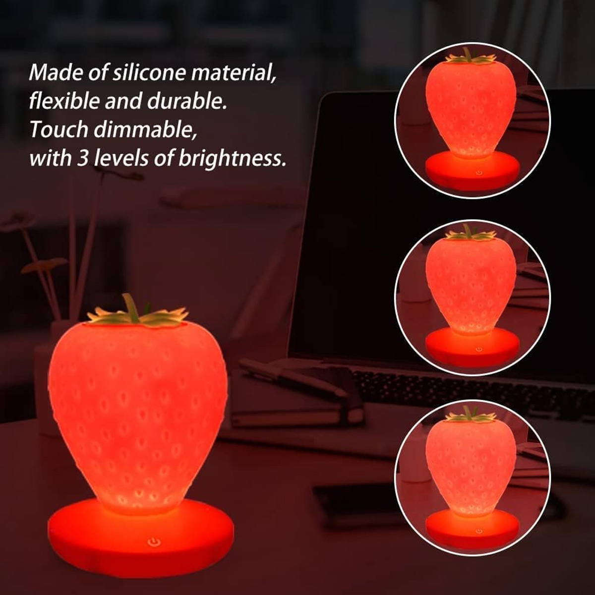 Silikontischlampe in Erdbeerform mit drei Helligkeitsstufen vor einem Laptop.