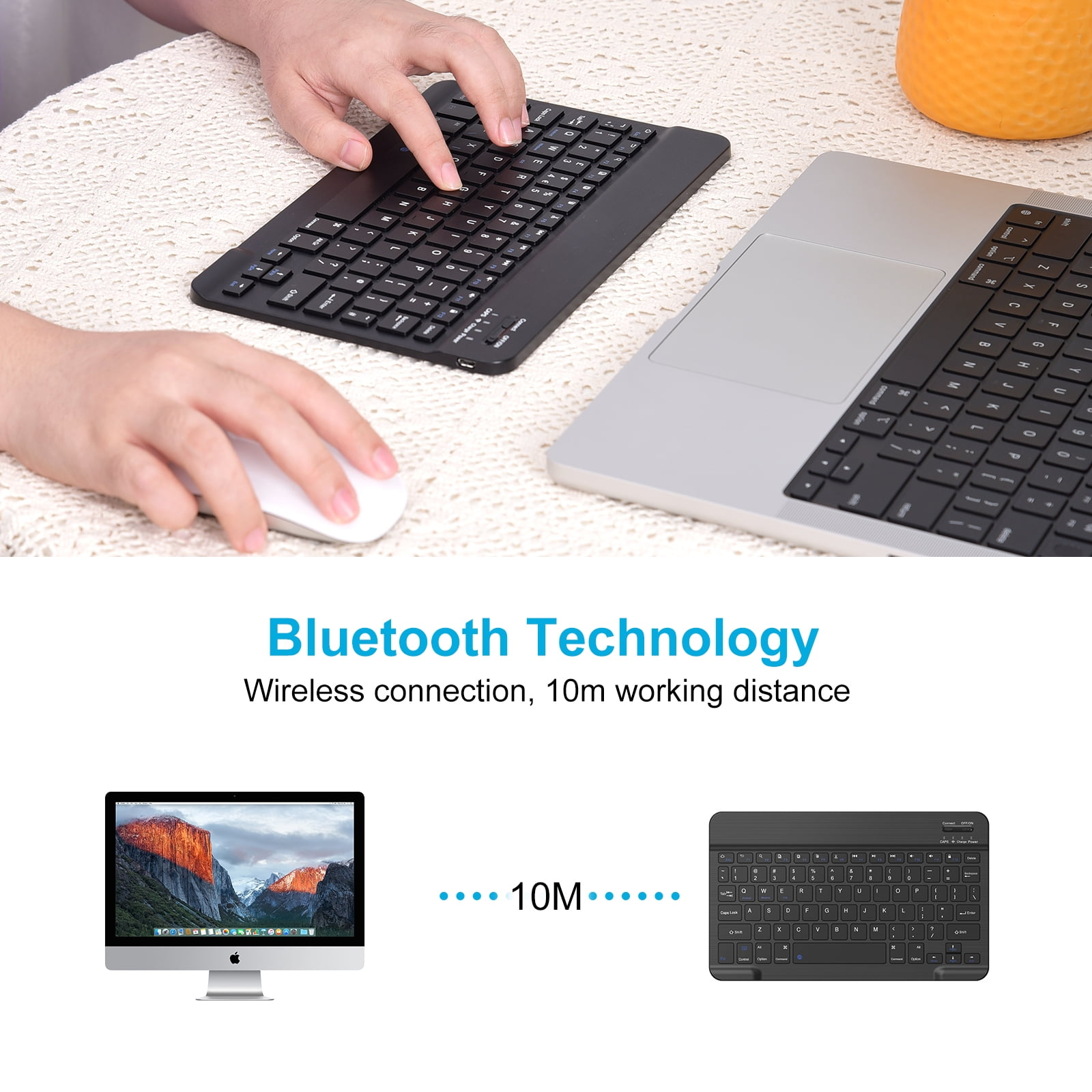 Hände tippen auf eine schwarze Bluetooth-Tastatur und bedienen eine weiße Maus neben einem Laptop.