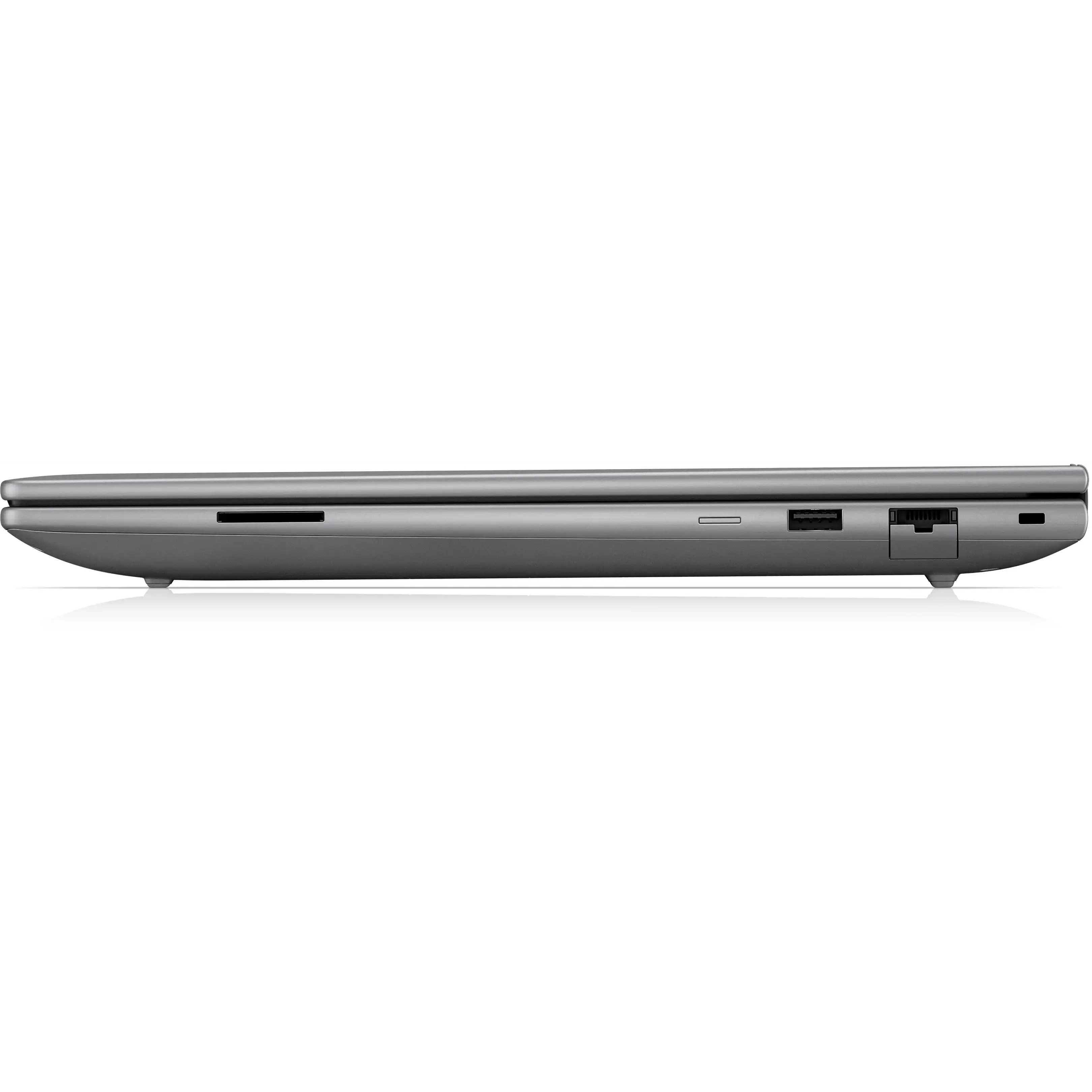 Vista laterale di un laptop grigio chiuso con porte su una superficie bianca riflettente su sfondo nero.
