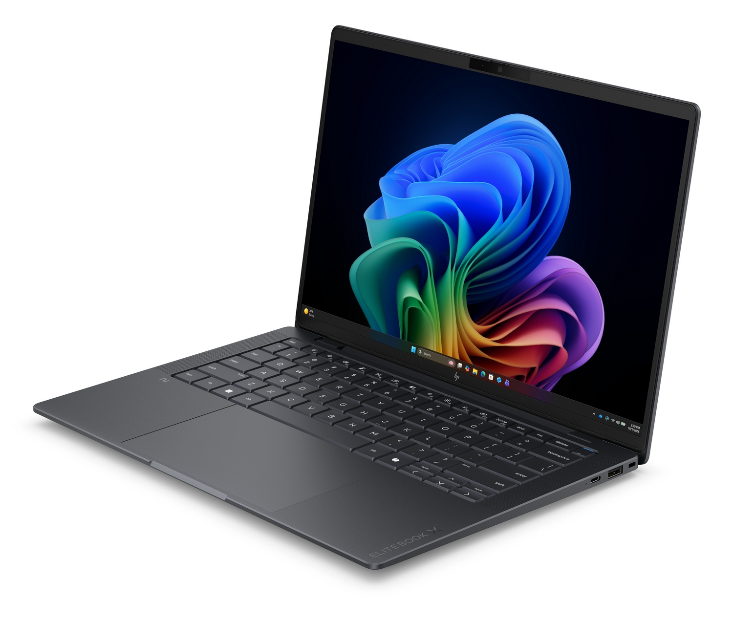Un computer portatile grigio scuro è aperto su una superficie bianca, mostrando un vivace sfondo astratto.