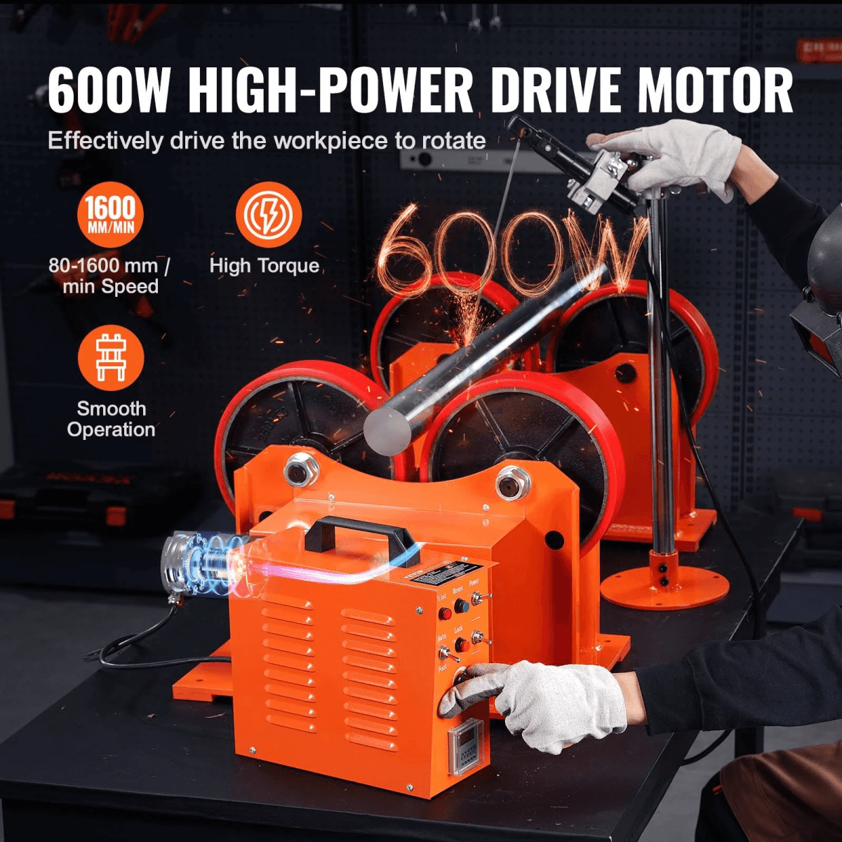 Un posicionador de soldadura de tubos de 600W con ruedas rojas y carcasa naranja en un banco de trabajo.