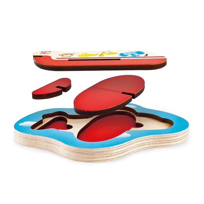 Un rompecabezas de madera con una base azul y piezas rojas sobre ilustraciones de animales.