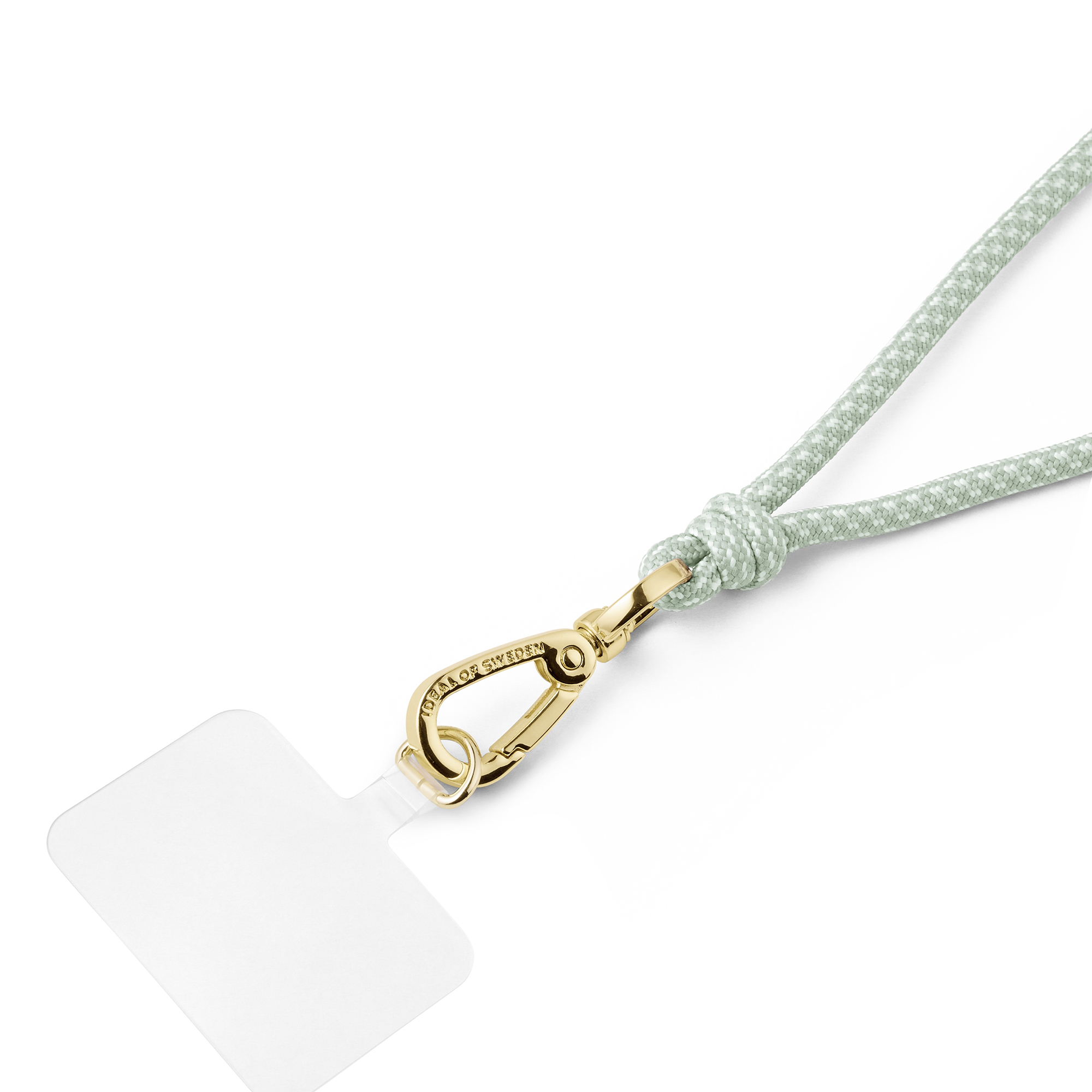 Ein hellgrünes Handyband mit Goldverschluss und durchsichtigem Patch vor weißem Hintergrund.