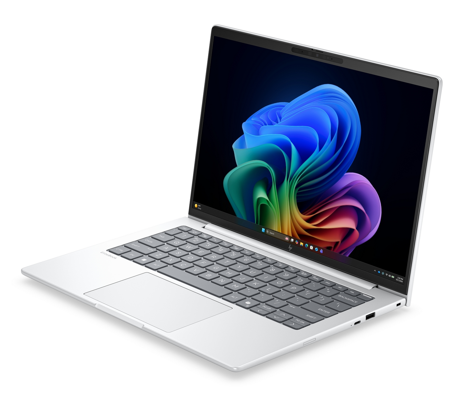 Un computer portatile argentato con lo schermo aperto che mostra grafica astratta colorata.