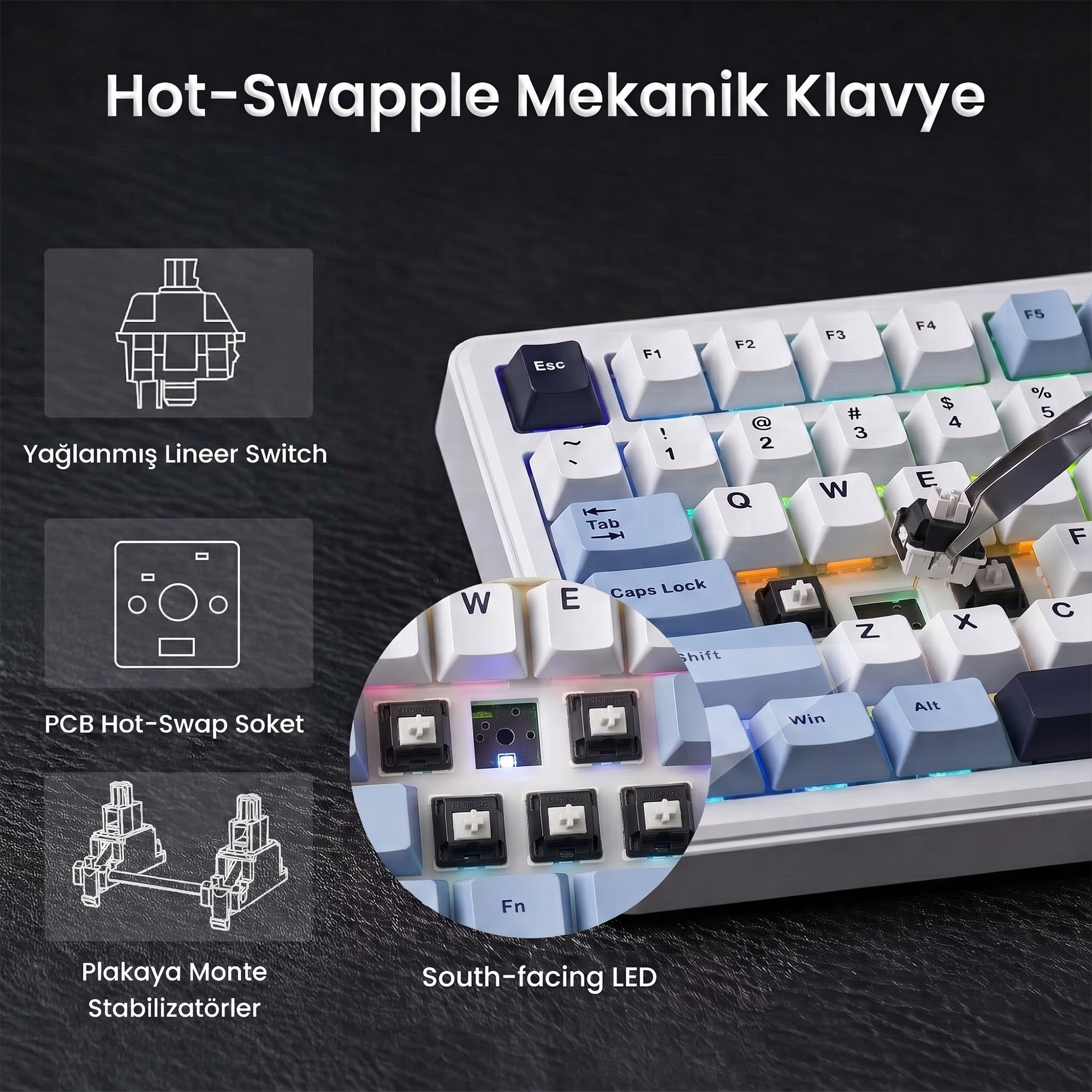Mavi ve beyaz tuş kapaklarına sahip mekanik klavye, cımbızla switch çıkarılışını gösteriyor.