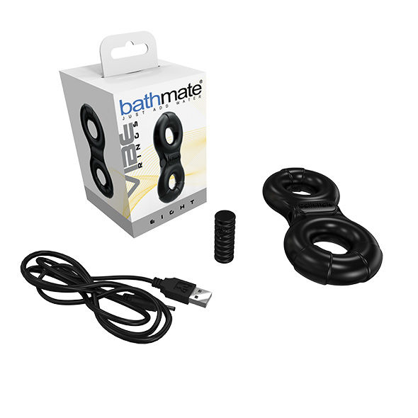 Juguete vibrador negro en forma de ocho con su caja, cable USB y pequeño cilindro.