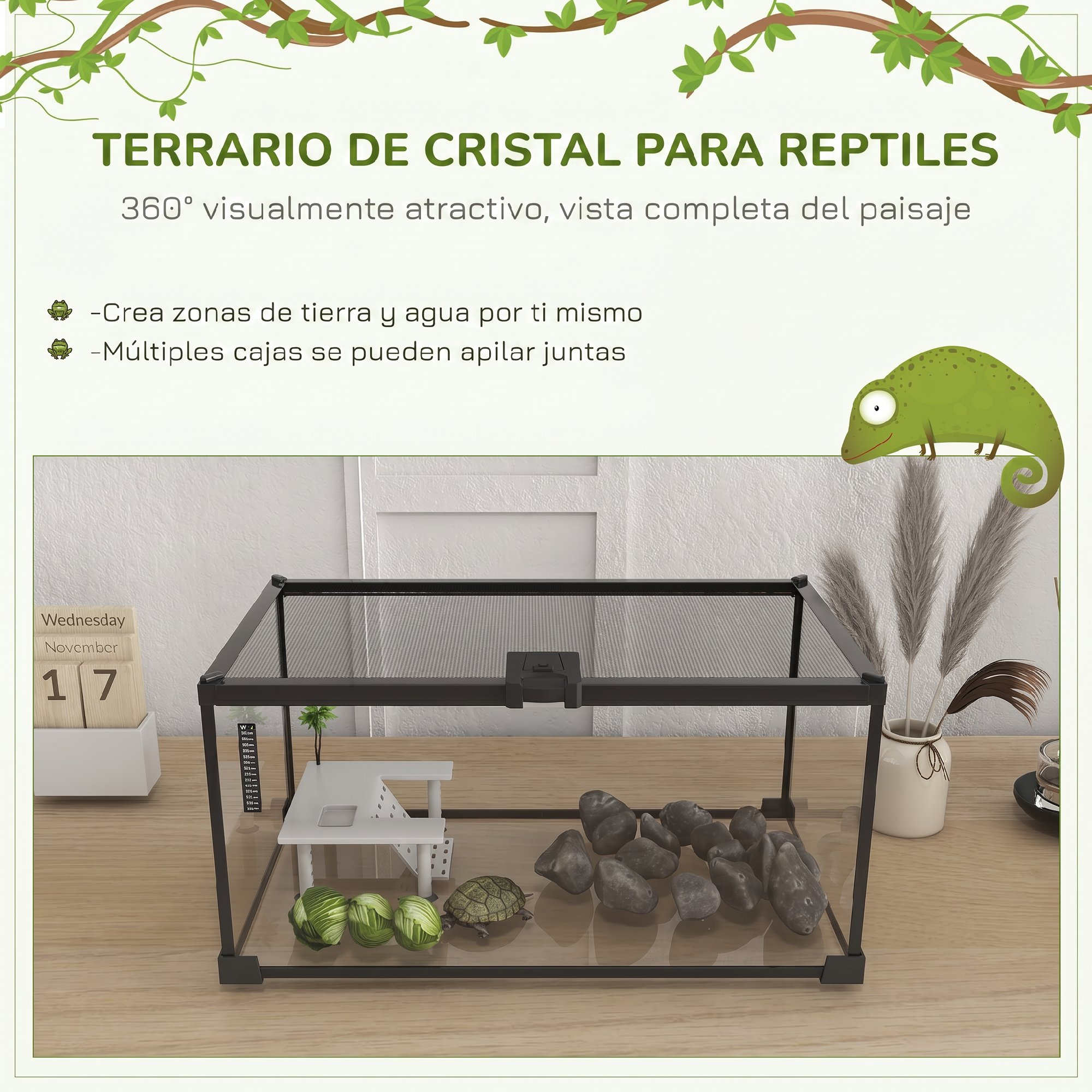 Un terrario de cristal para reptiles con rocas, tortuga y decoración sobre una mesa.