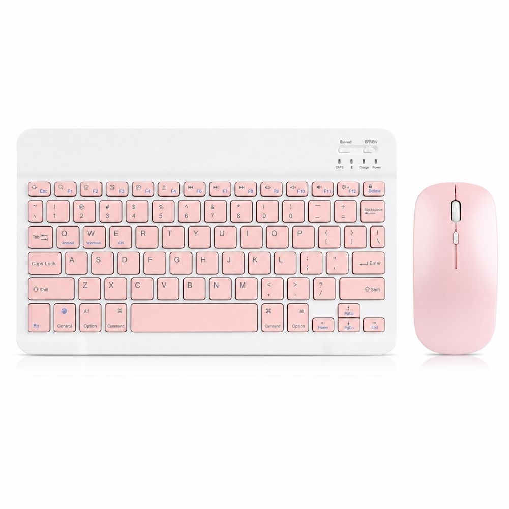 Beyaz yüzey üzerinde pastel pembe yuvarlak tuşlara sahip beyaz kablosuz klavye ve uyumlu pembe bilgisayar faresi.