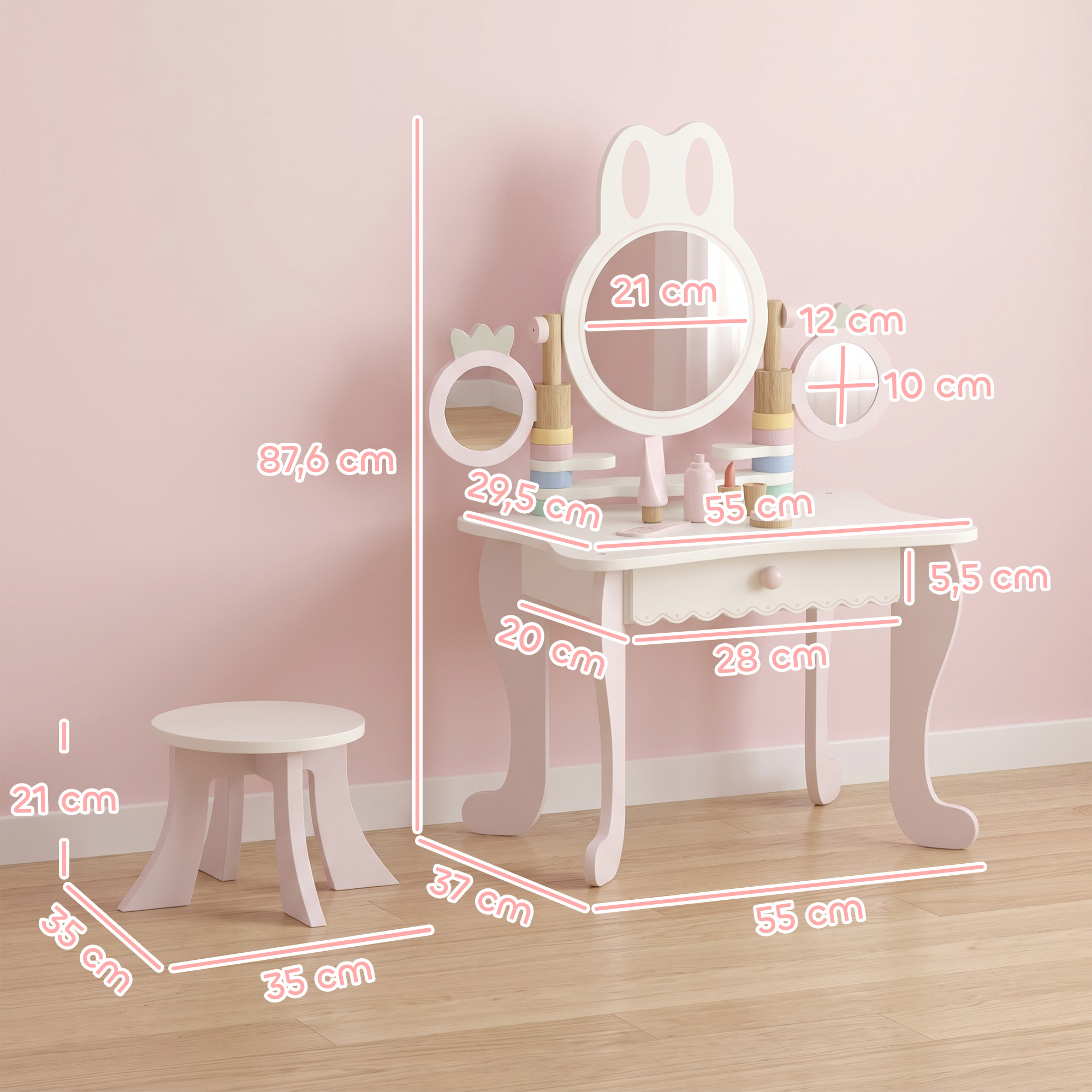 Tocador infantil de madera en rosa y blanco con taburete a juego y dimensiones en centímetros superpuestas.