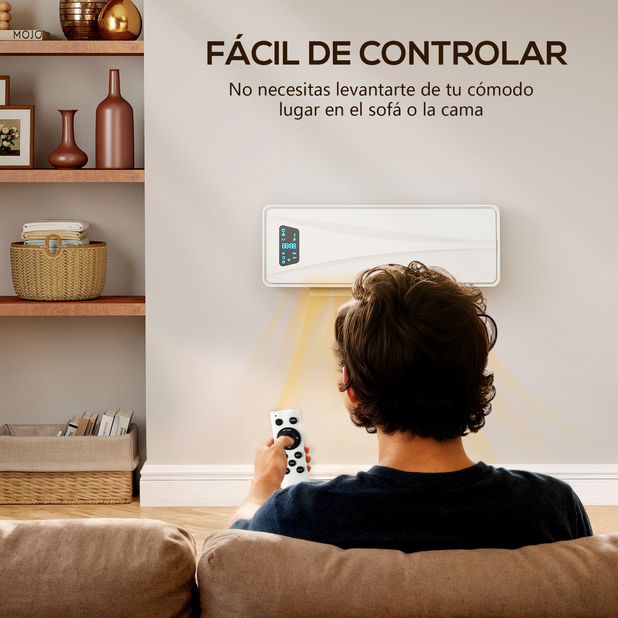 Un hombre sentado en un sofá usa un control remoto para un calefactor de pared.