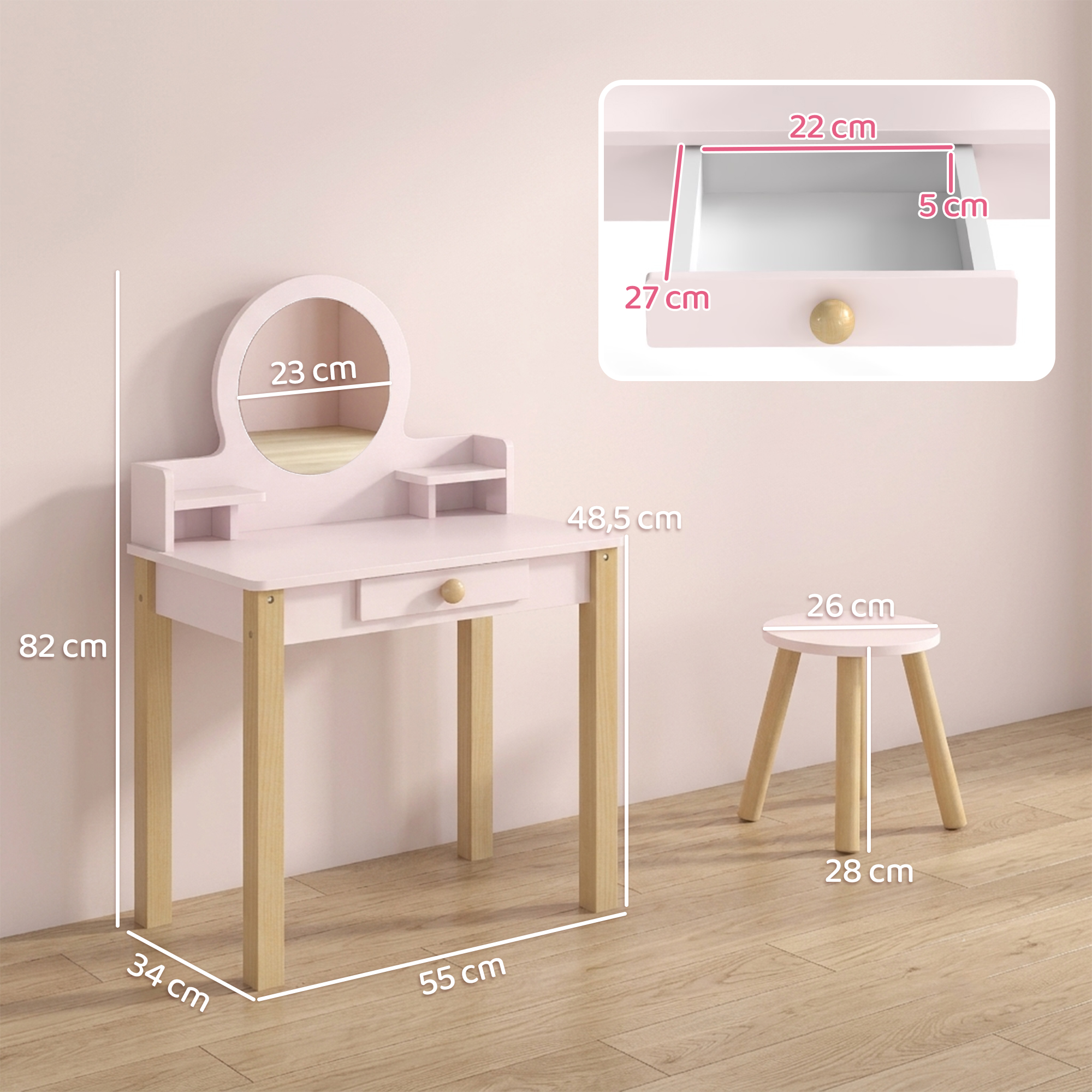 Tocador infantil rosa con taburete, espejo y medidas frente a una pared rosa.