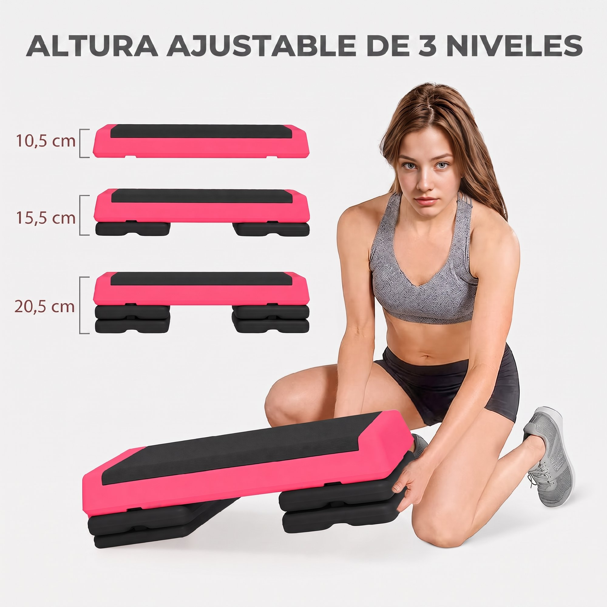 Una mujer se arrodilla ajustando un step aeróbico rosa y negro. Los diagramas muestran tres alturas: 10,5, 15,5 y 20,5 cm.