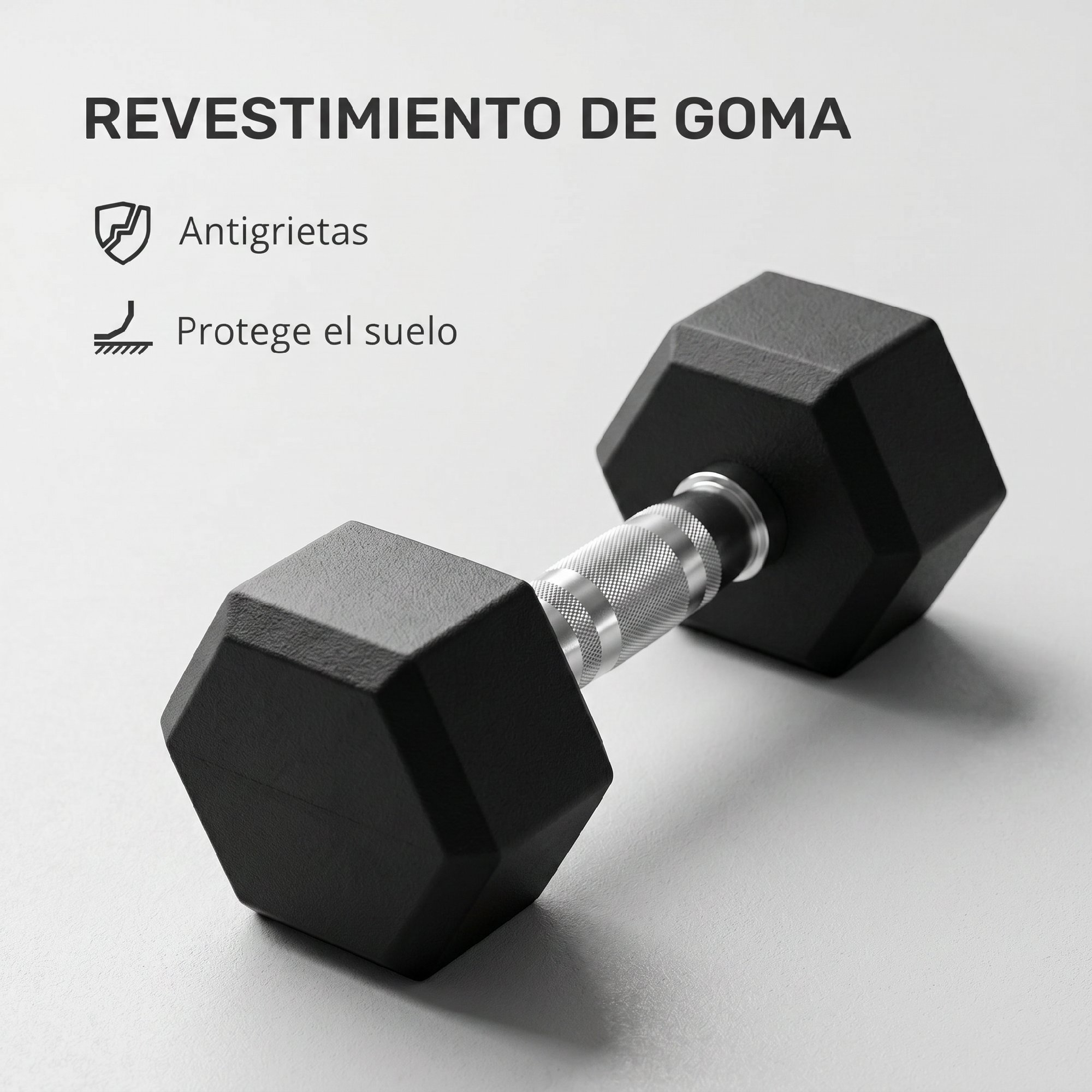 Mancuerna hexagonal de goma negra con mango plateado texturizado sobre superficie gris con texto en español.