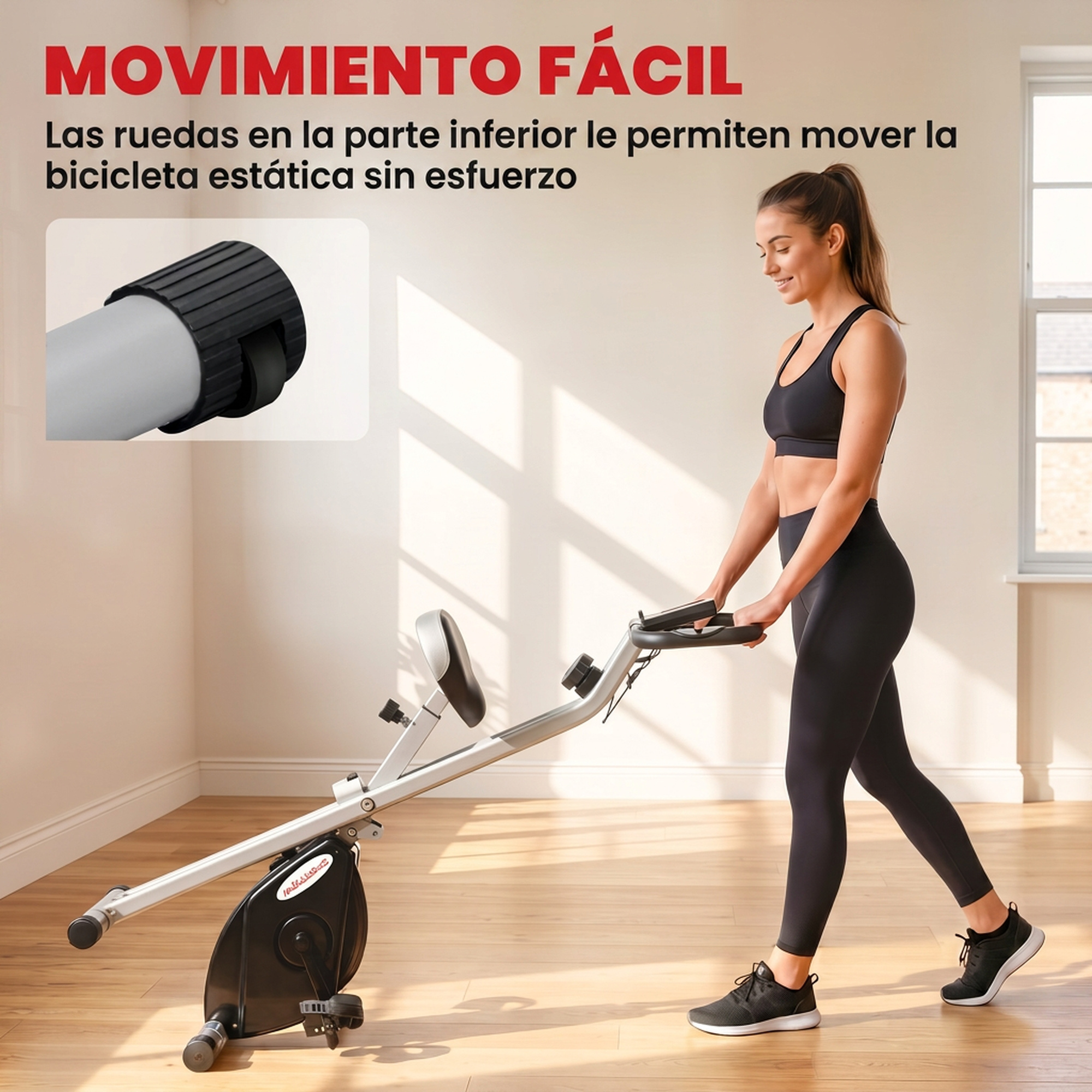 Una mujer en ropa deportiva empuja una bicicleta estática con ruedas de transporte en un suelo de madera.