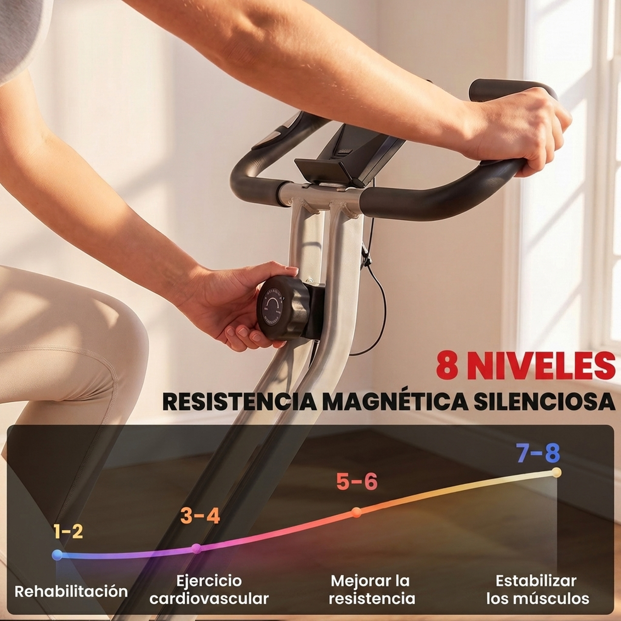 Una persona ajusta la perilla de resistencia en una bicicleta estática con sistema magnético.