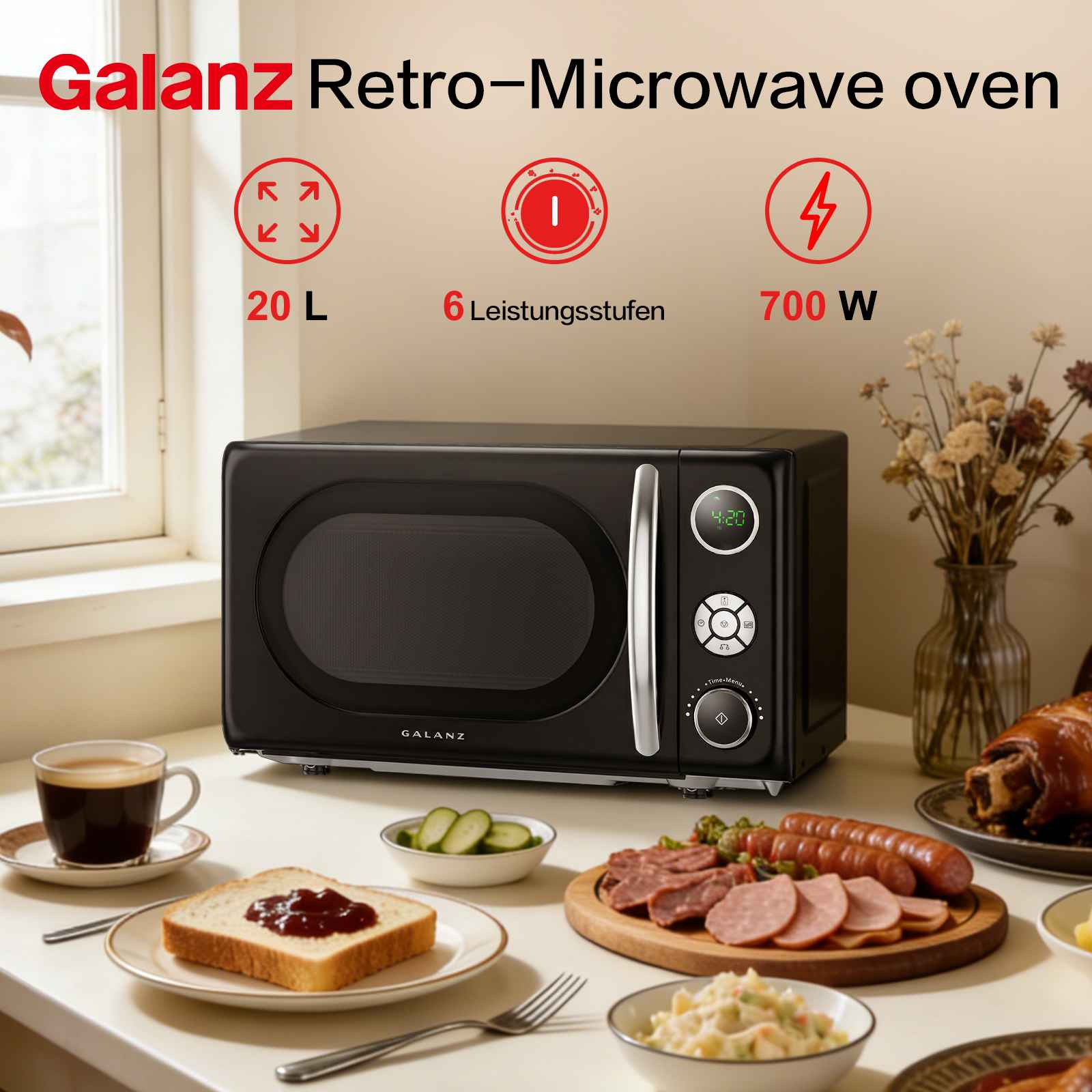 Schwarze Galanz Retro-Mikrowelle auf einem Küchentisch mit Essen, Kaffee und Dekoration.