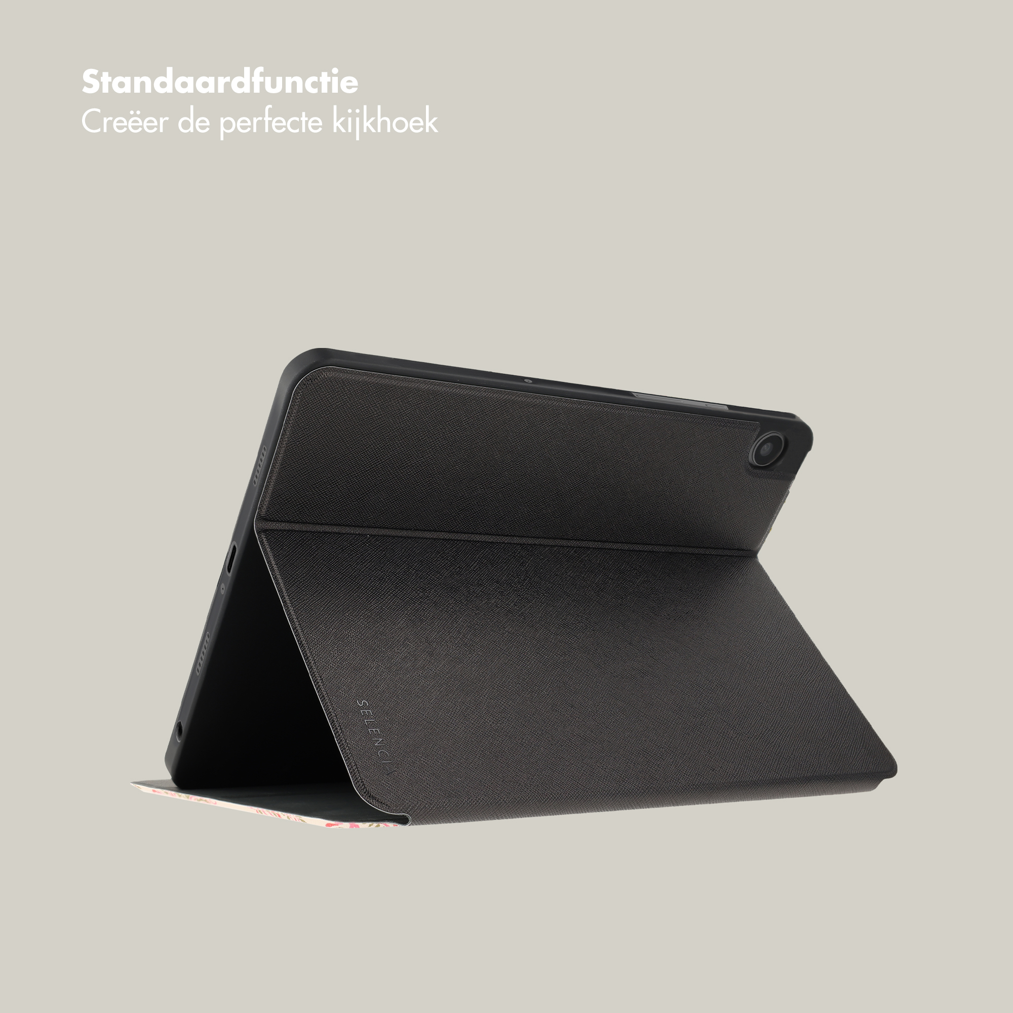 Une tablette noire dans un étui de protection repose sur une surface gris clair sur fond neutre.