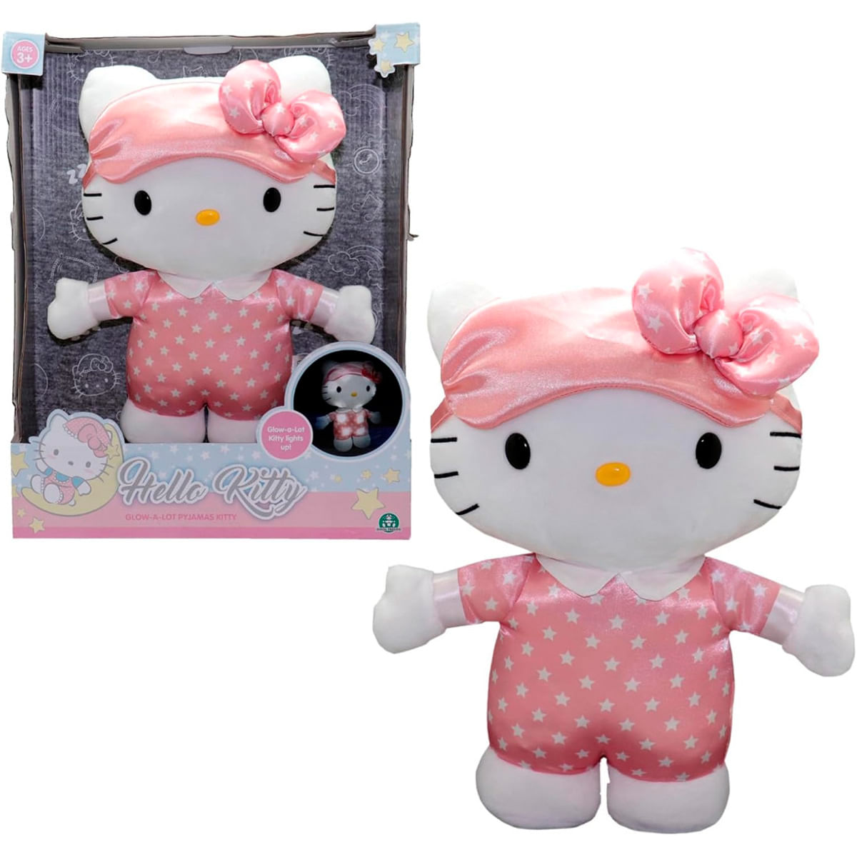 Peluche de Hello Kitty en pijama rosa con antifaz y lazo, mostrado junto a su caja.