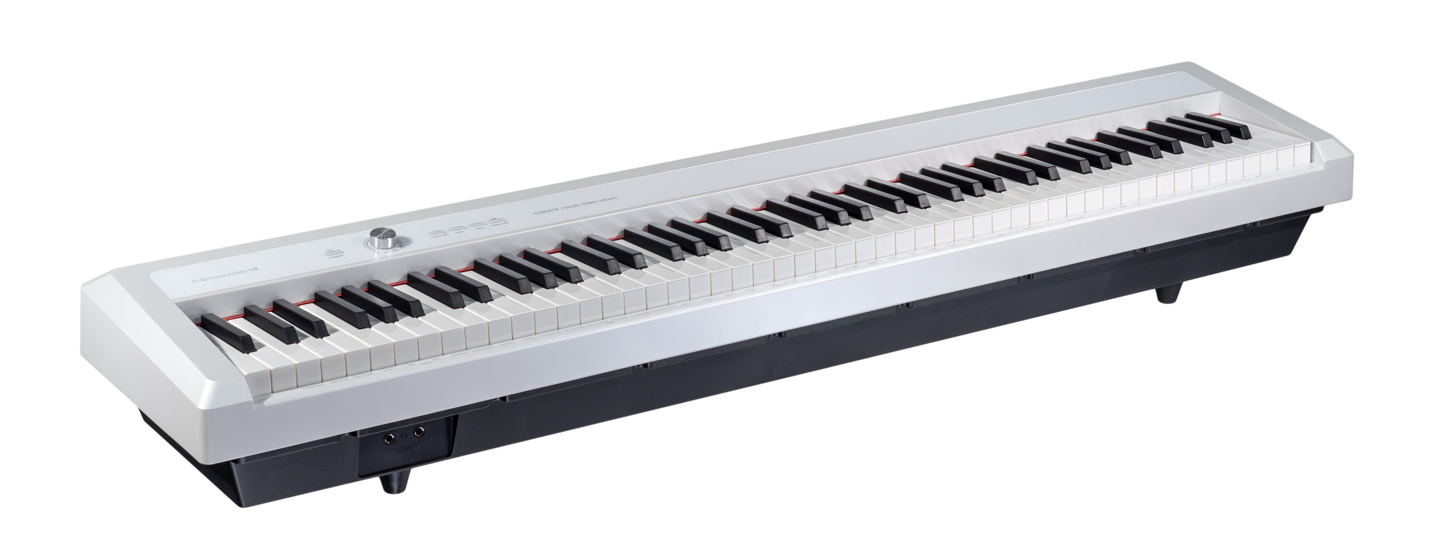 Ein weiß-schwarzes Digitalpiano mit Tasten auf einer weißen Oberfläche und schwarzem Korpus.