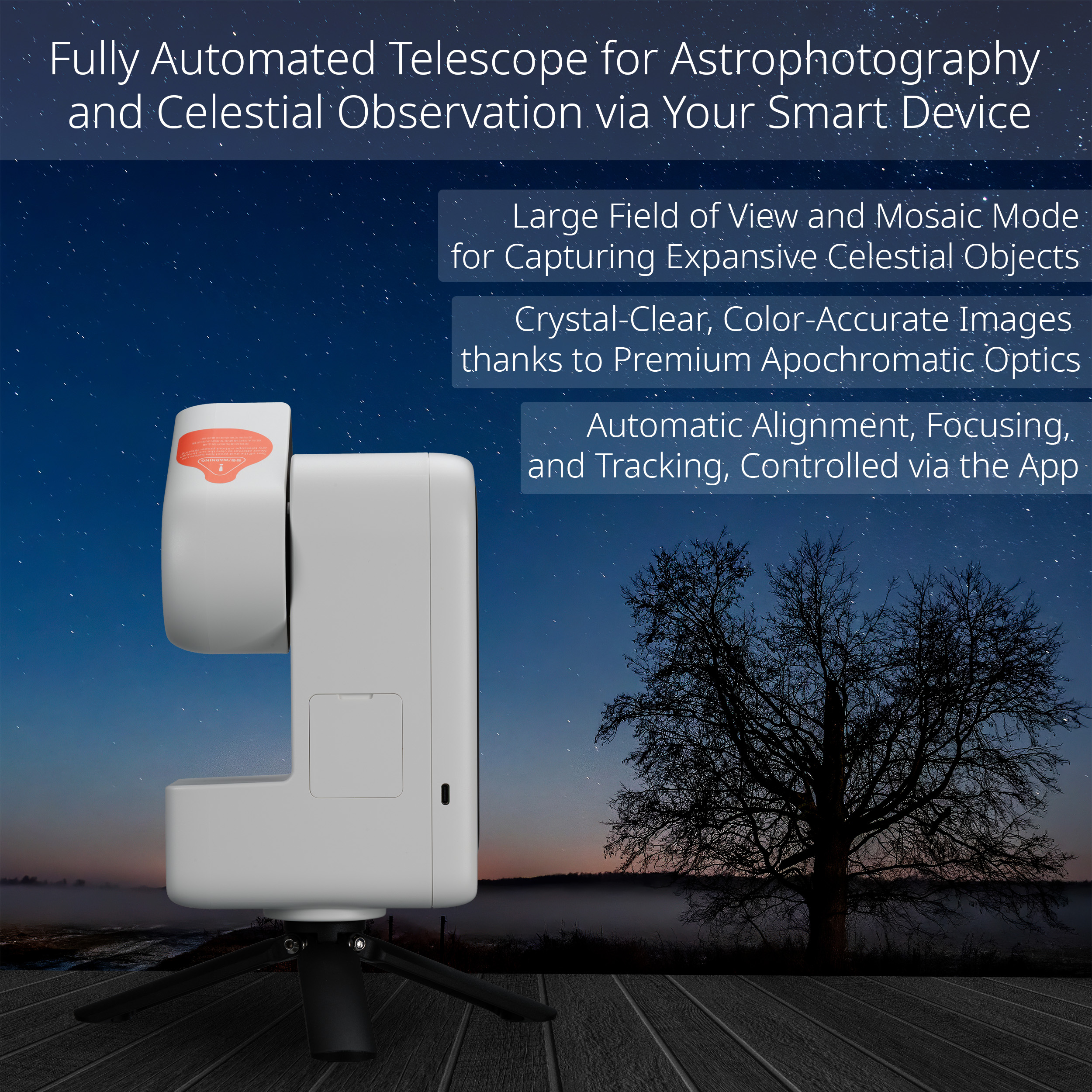Un telescopio automatizado blanco sobre un trípode frente a un cielo nocturno estrellado y un árbol.