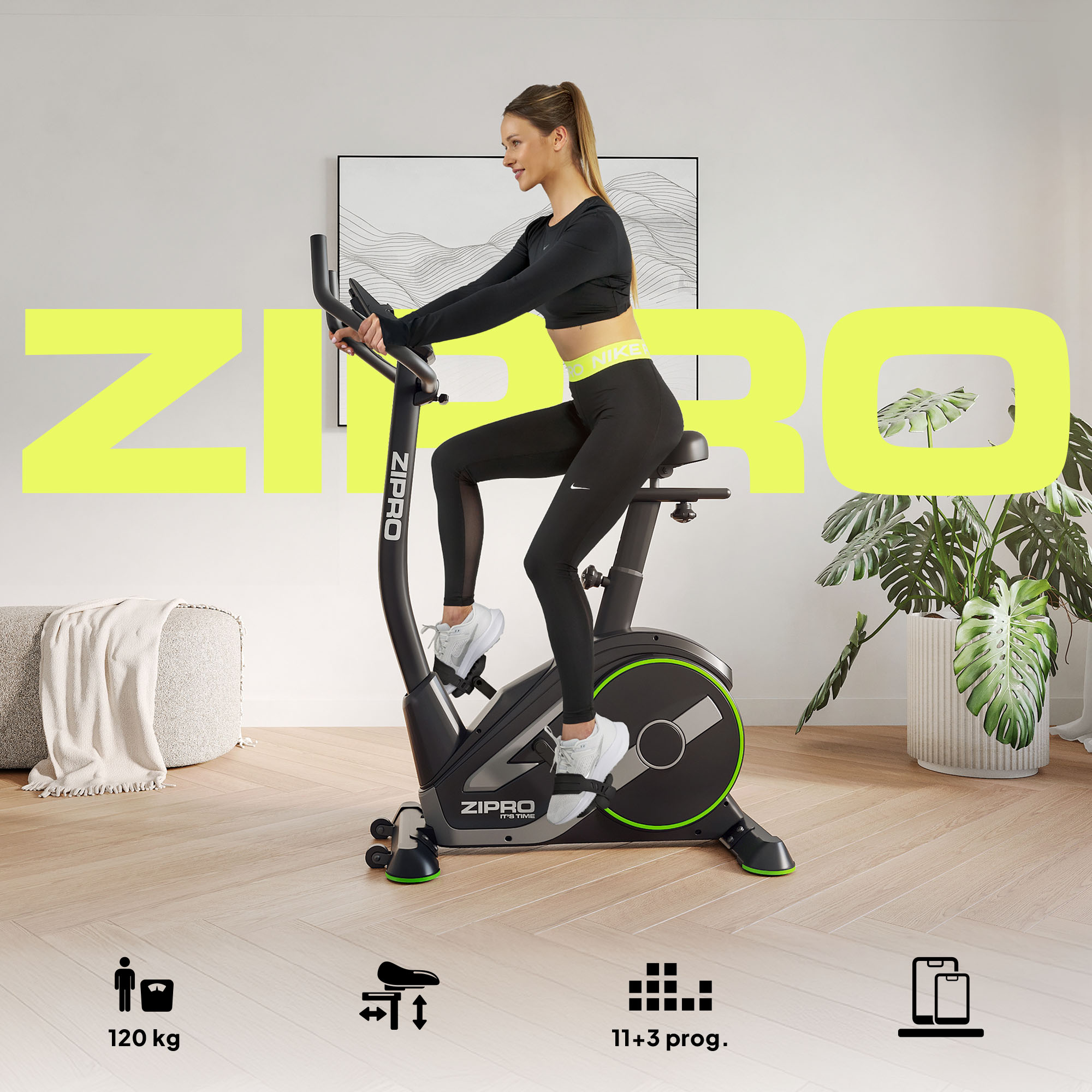 Una donna in abbigliamento sportivo nero pedala su una cyclette Zipro nera e verde in una stanza luminosa.