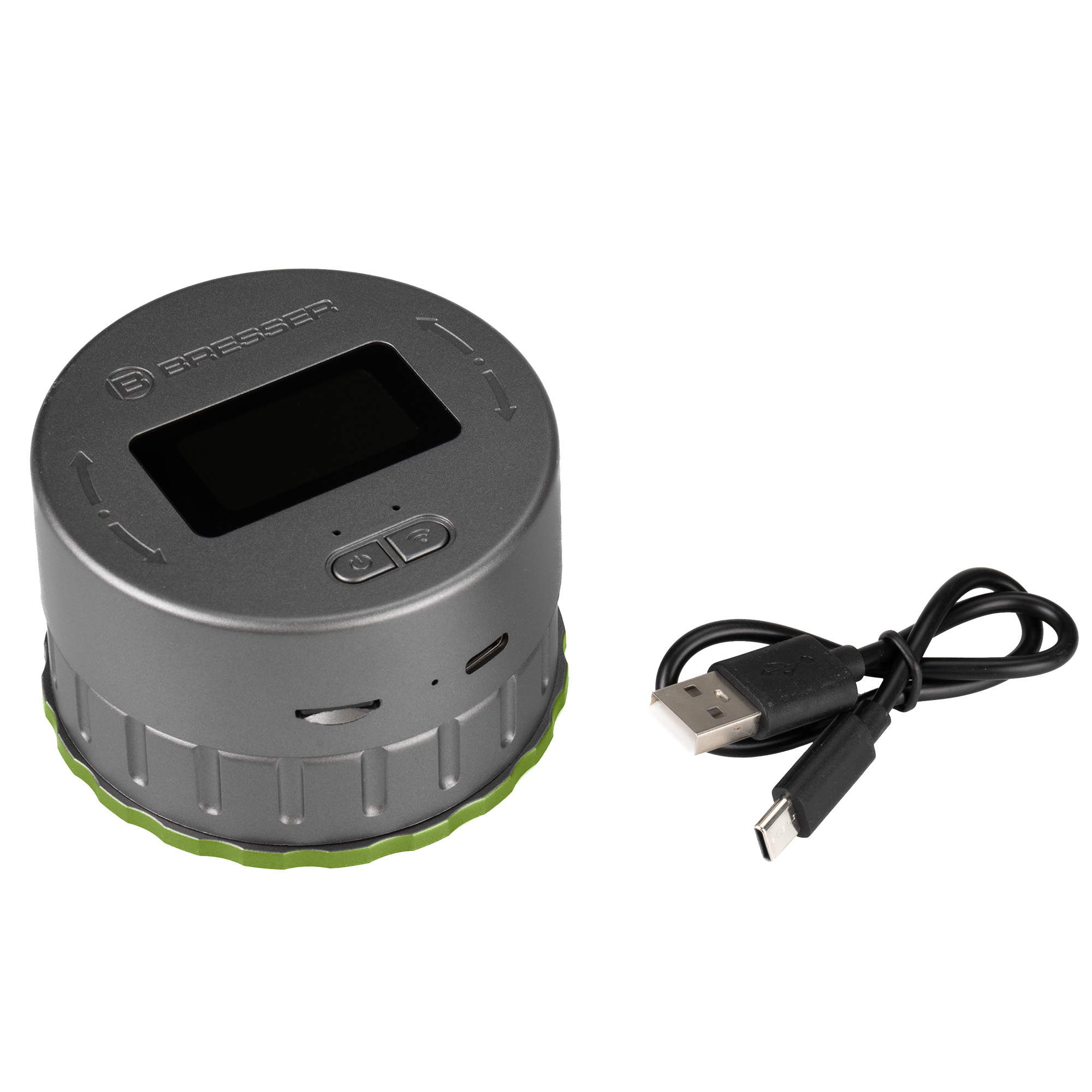 Dispositivo gris Bresser con pantalla, dos botones, puertos y un cable USB sobre fondo blanco.