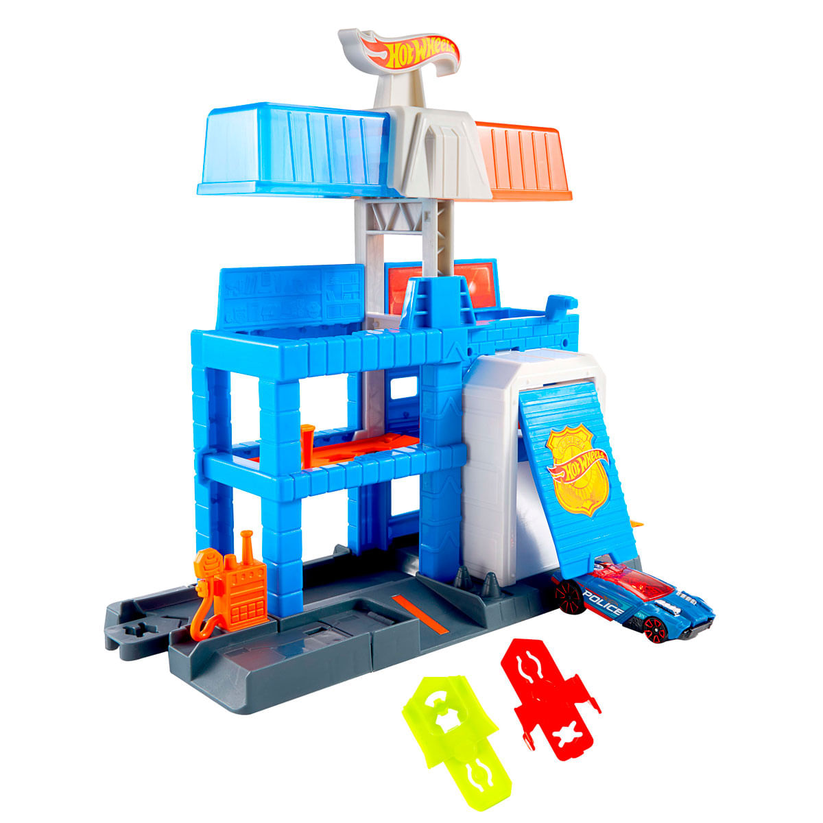 Estación de policía de Hot Wheels con estructura azul, garaje, coche de juguete azul y piezas verde neón y rojas.