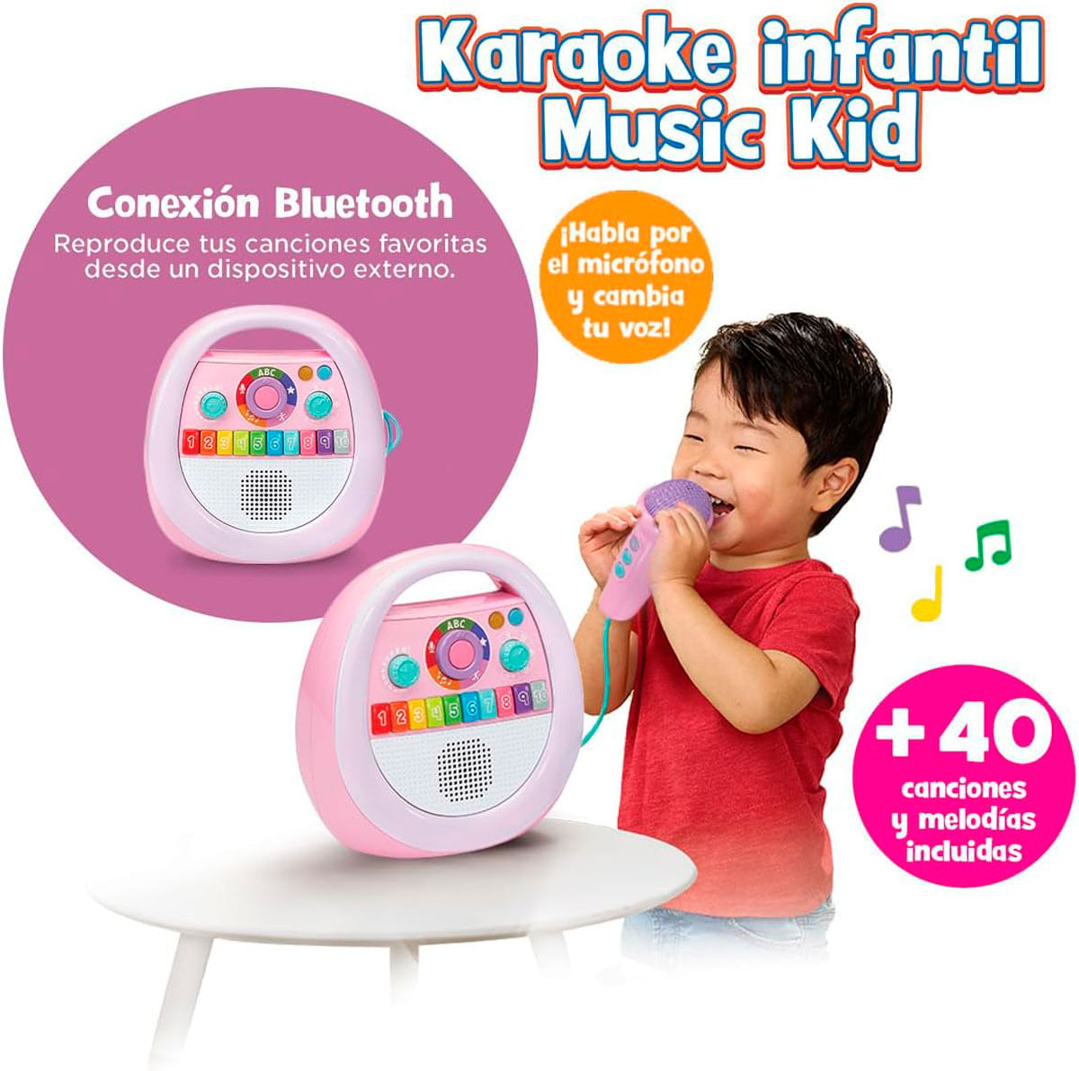 Un niño con camisa roja canta en un micrófono, junto a una máquina de karaoke infantil rosa en una mesa.