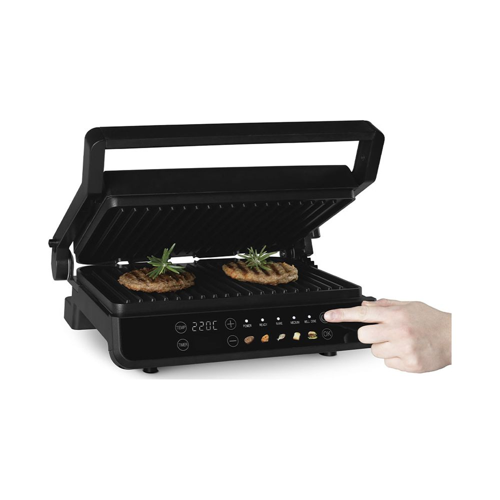 Ein Finger drückt die Taste eines offenen schwarzen Elektrogrills mit zwei Patties.