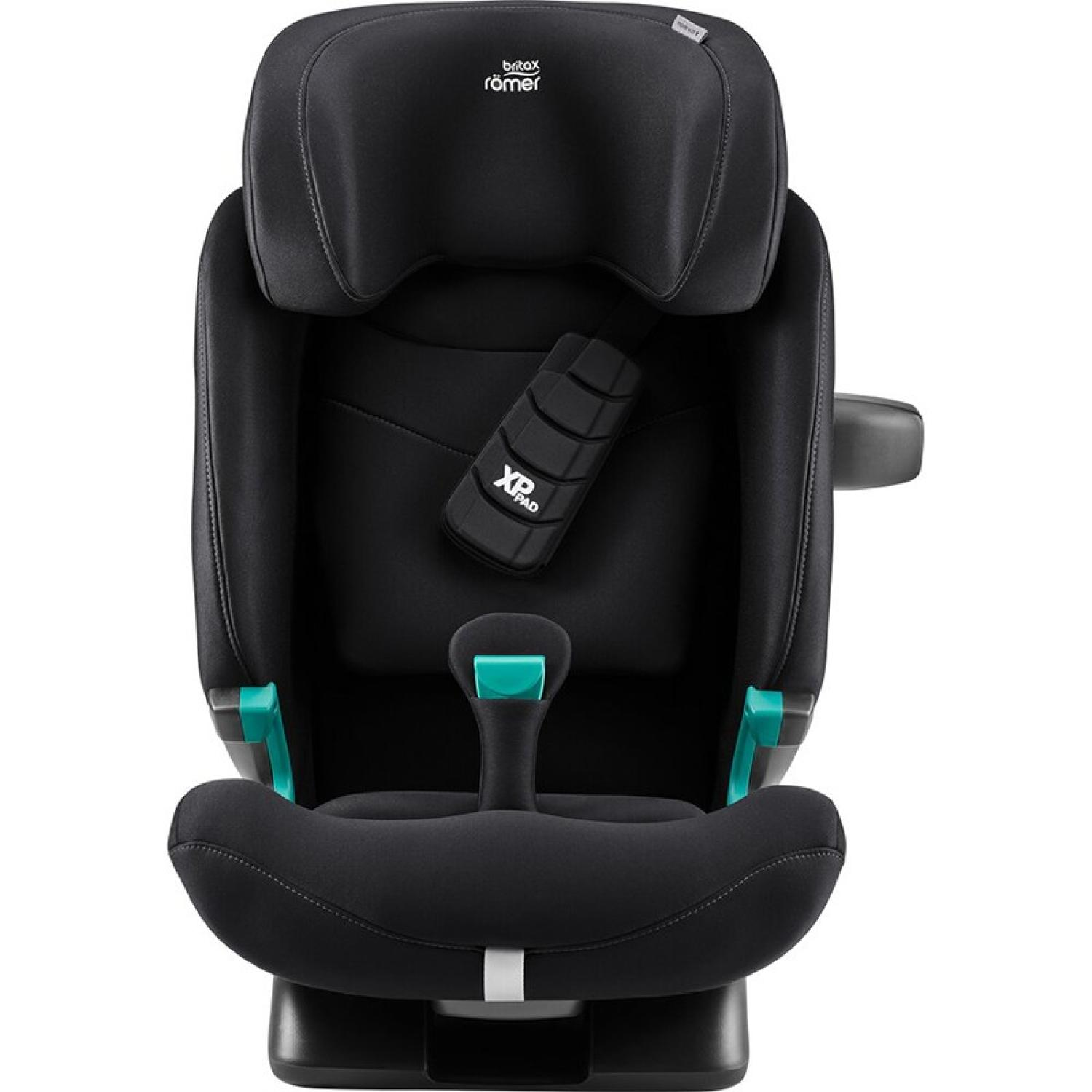 Una sillita de coche negra Britax Römer con reposacabezas, XP-PAD y detalles en turquesa sobre fondo blanco.