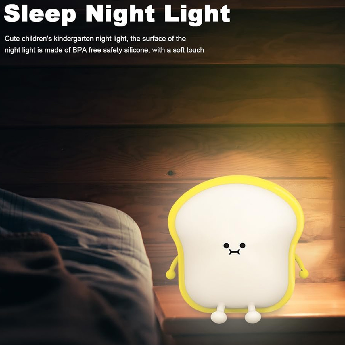 Ein süßes, brotförmiges Nachtlicht auf einem Holztisch neben einem Bett.