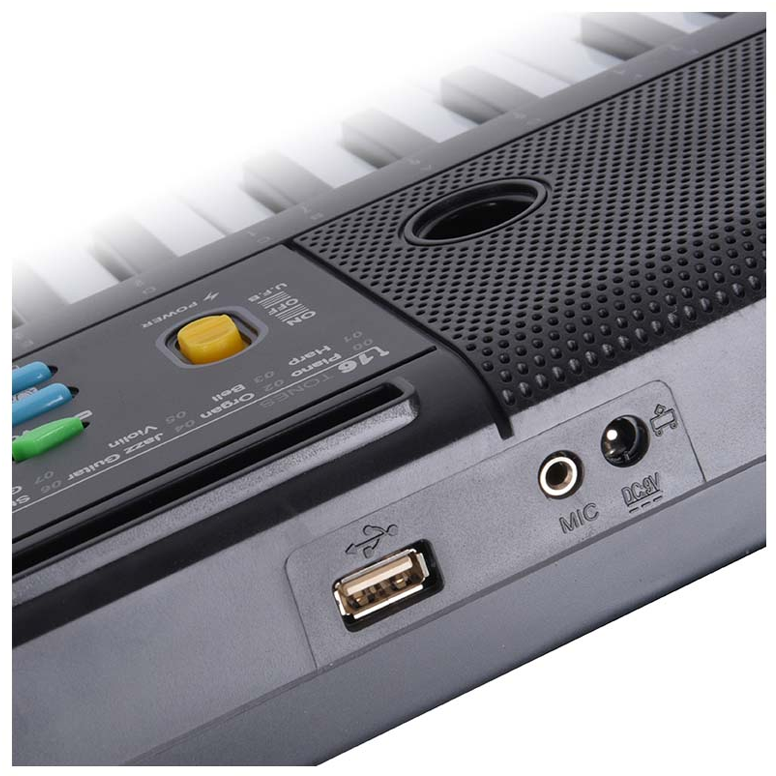 Nahaufnahme einer schwarzen elektrischen Tastatur mit Anschlüssen, Tasten, Lautsprechergitter und Tasten.