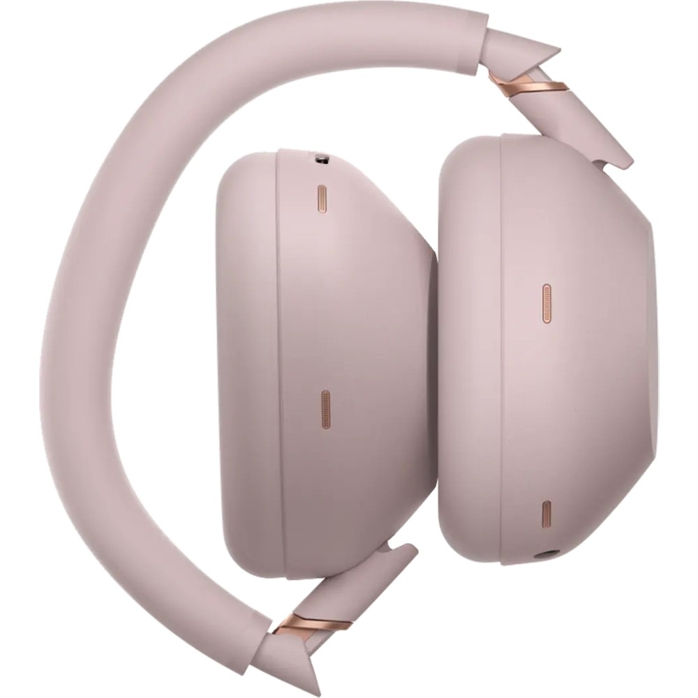 Cuffie wireless over-ear rosa piegate, viste di lato su sfondo bianco.