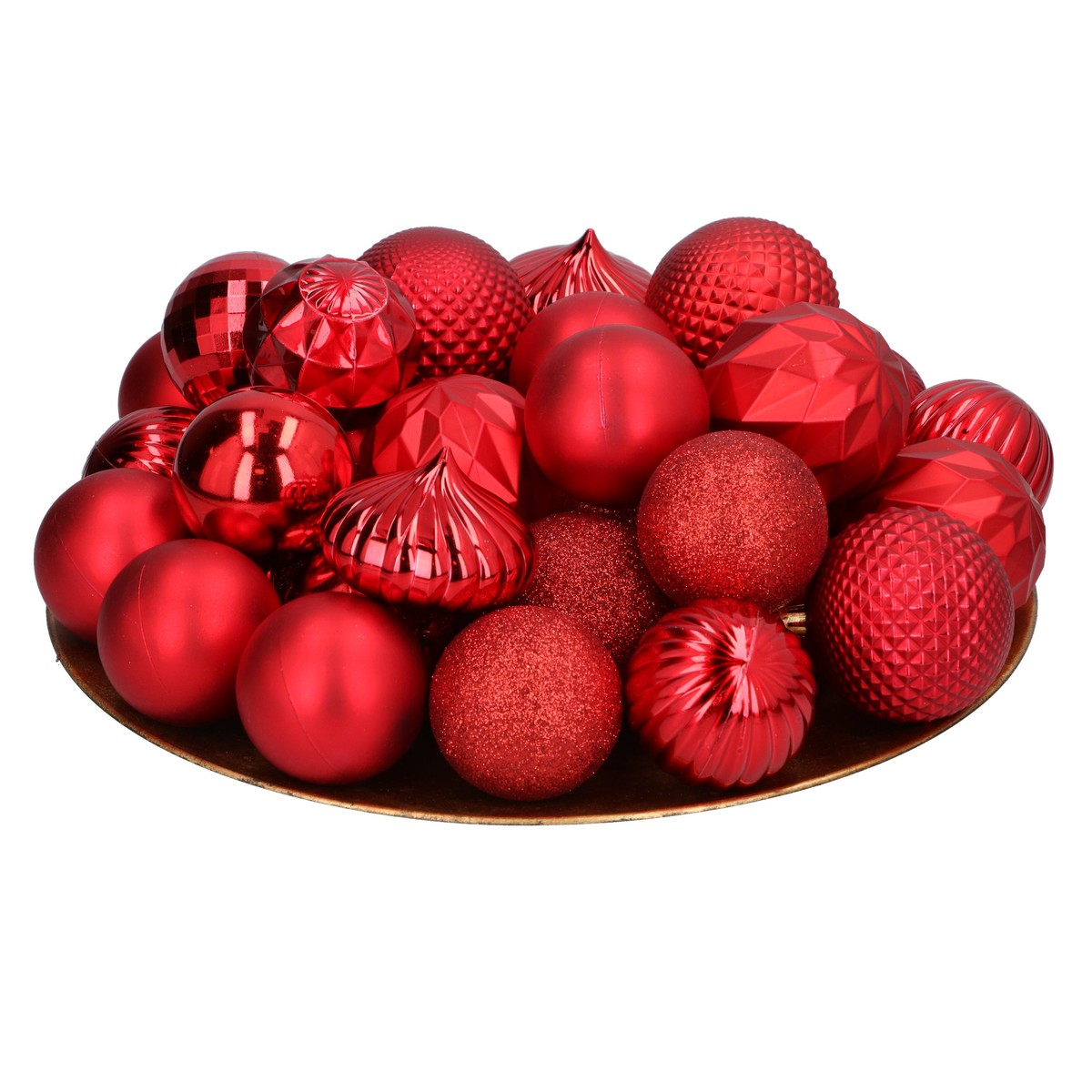 A golden bowl filled with red Christmas ornaments in various patterns and textures.