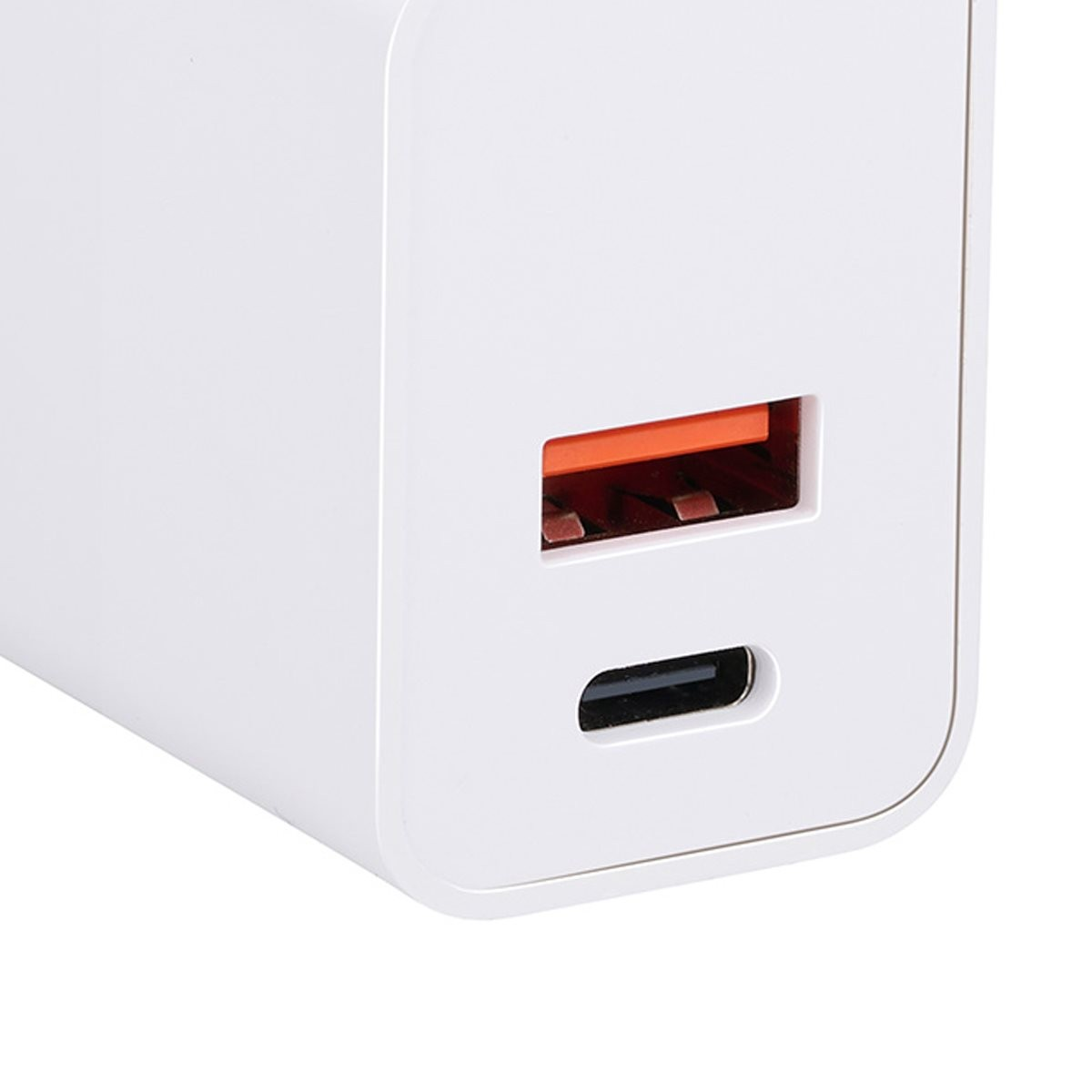 A white USB wall charger with an orange USB-A port on top and a USB-C port below.