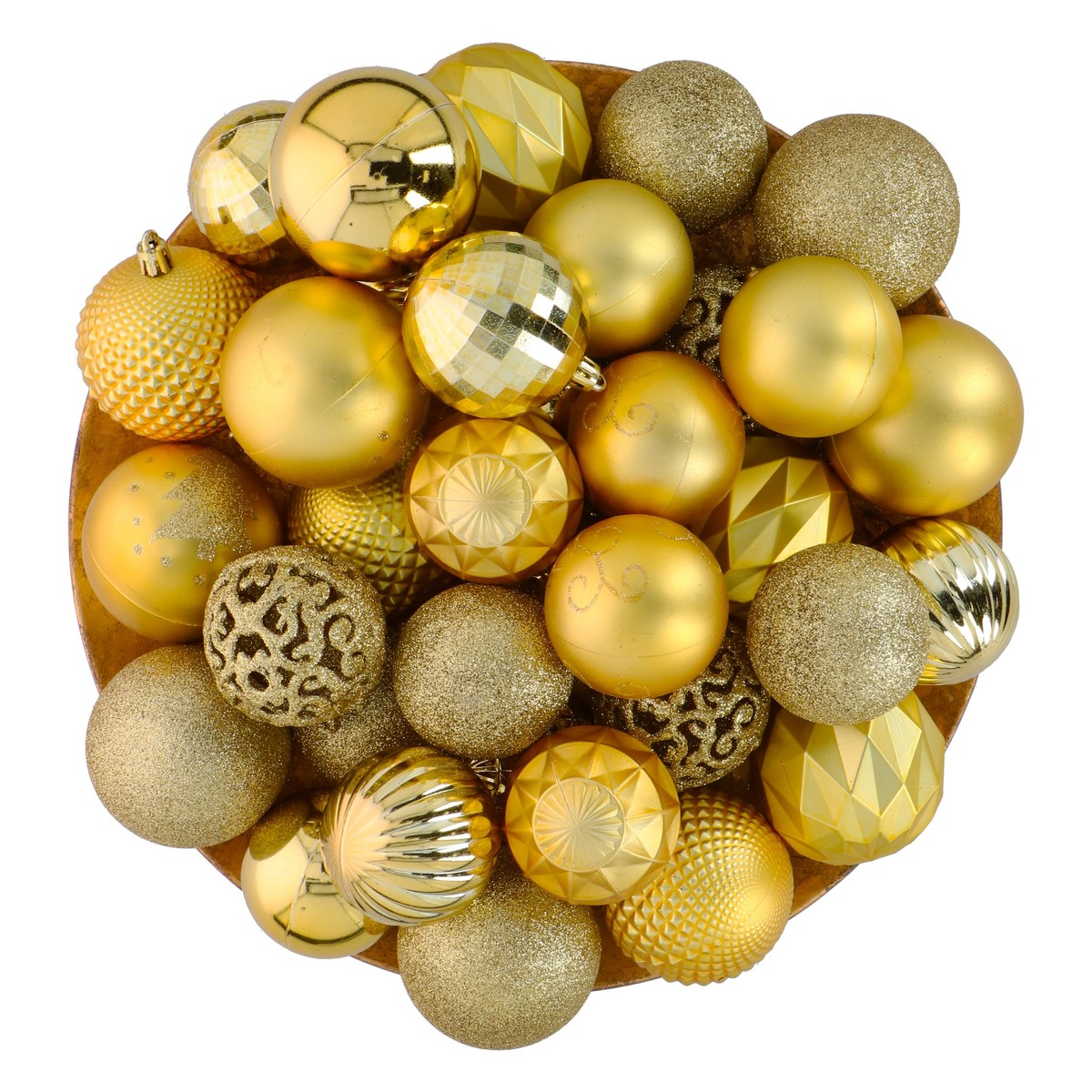 A bowl filled with shiny, gold Christmas ornaments in various textures and patterns.