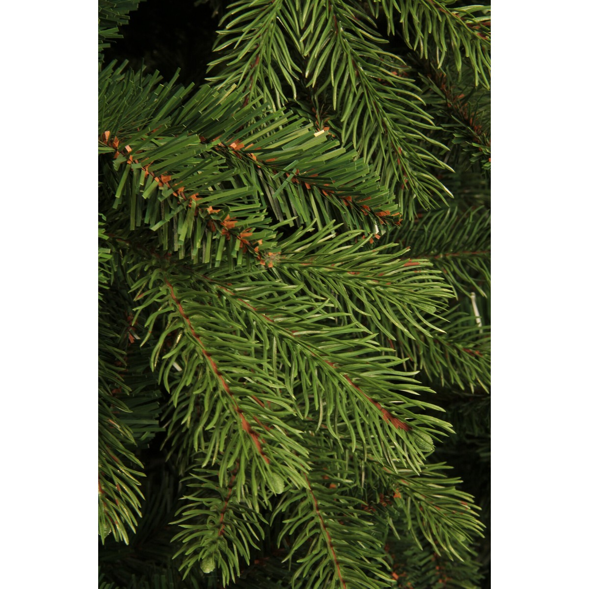Close-up of green artificial pine branches with brown accents.