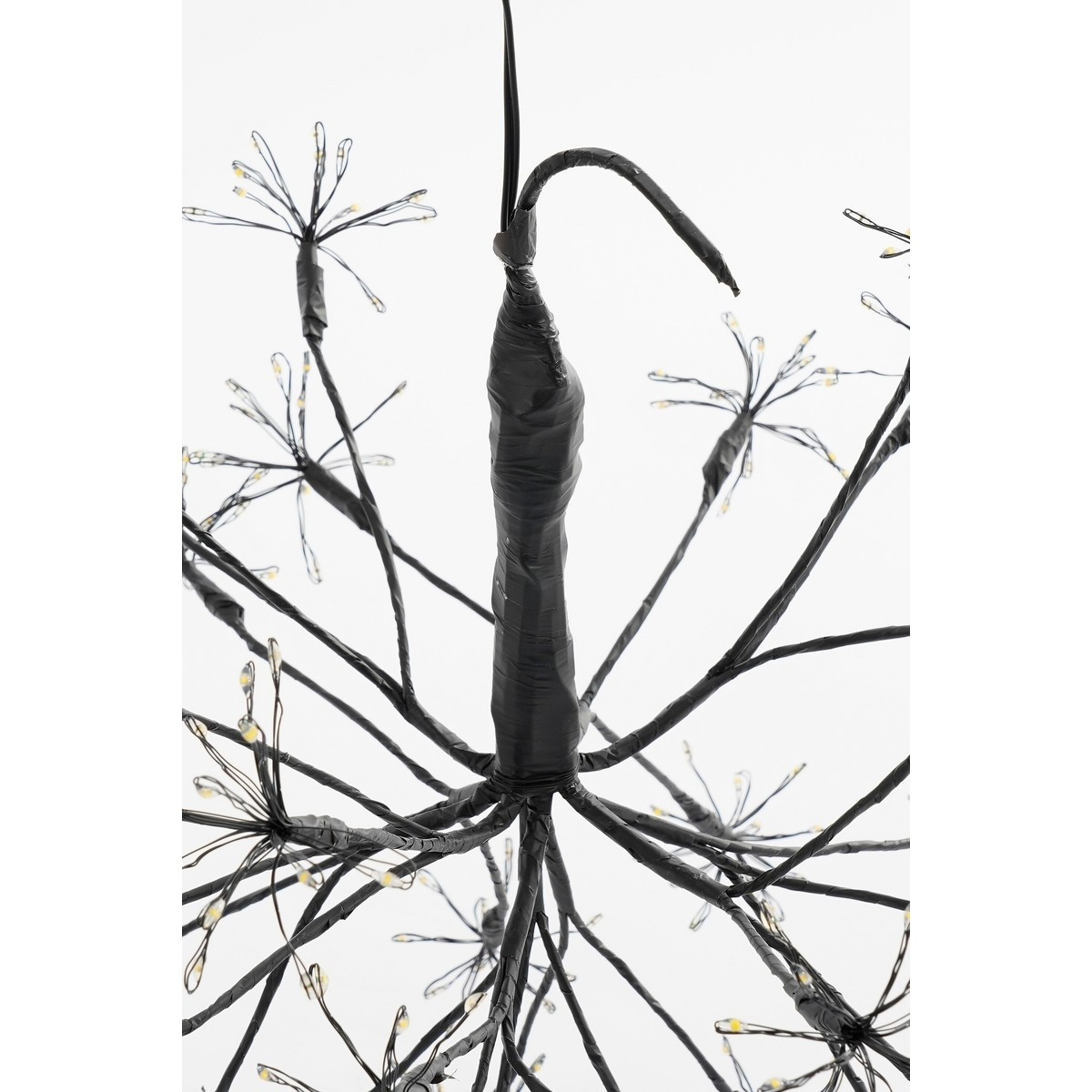 A black firework-shaped LED ceiling light with thin branches and small glowing lights on a white background.