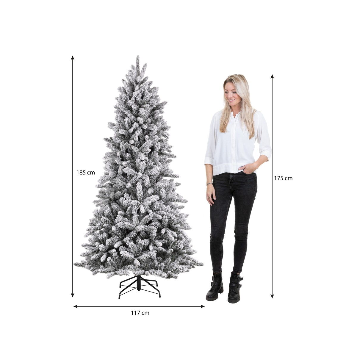 A woman stands next to an artificial snow-covered Christmas tree, with dimension indicators.