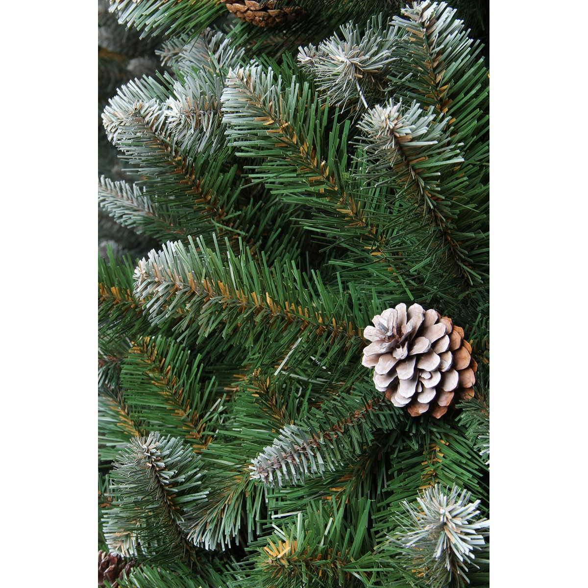 Artificial green pine branches with white tips and a pinecone.