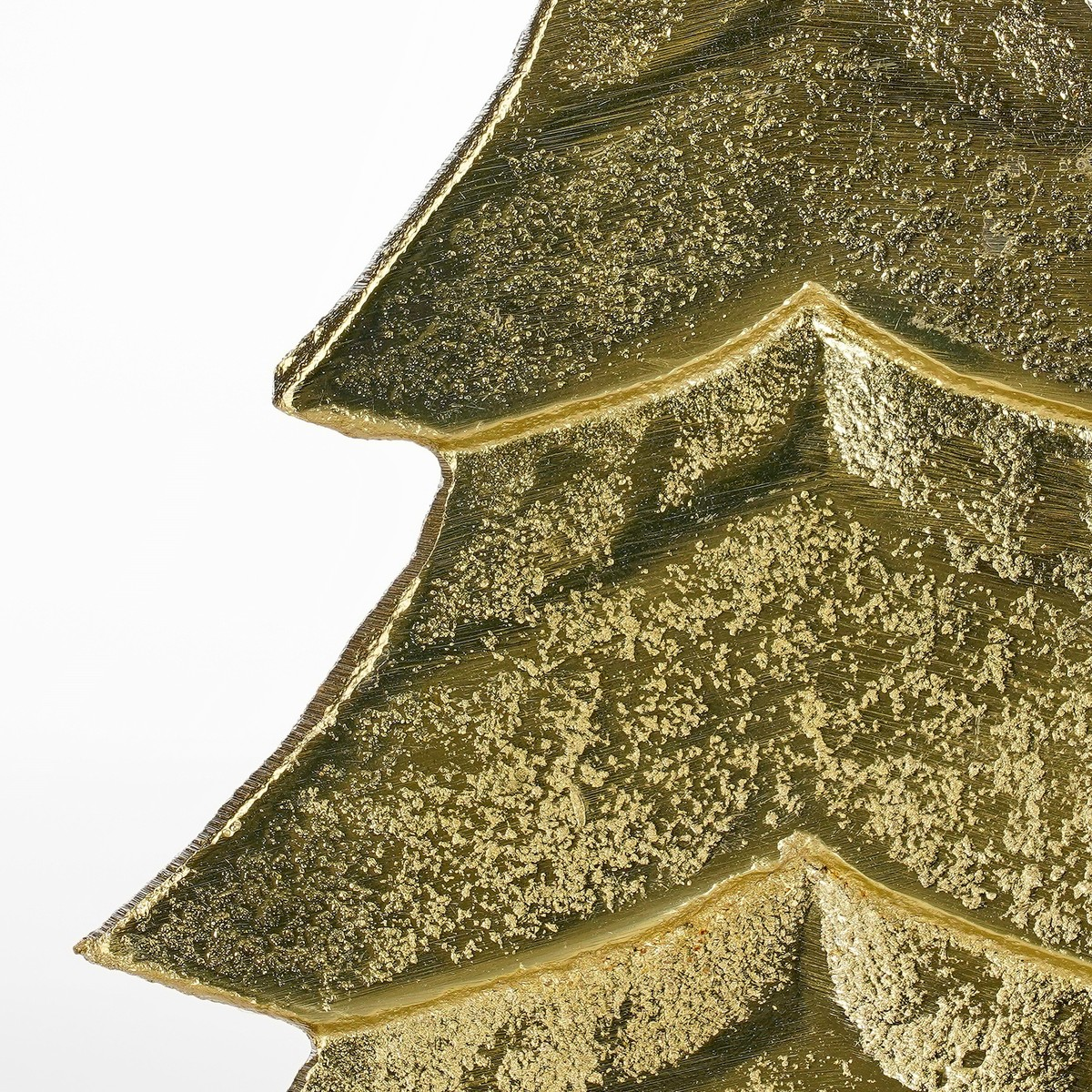 A close-up of a golden textured Christmas tree ornament against a white background.