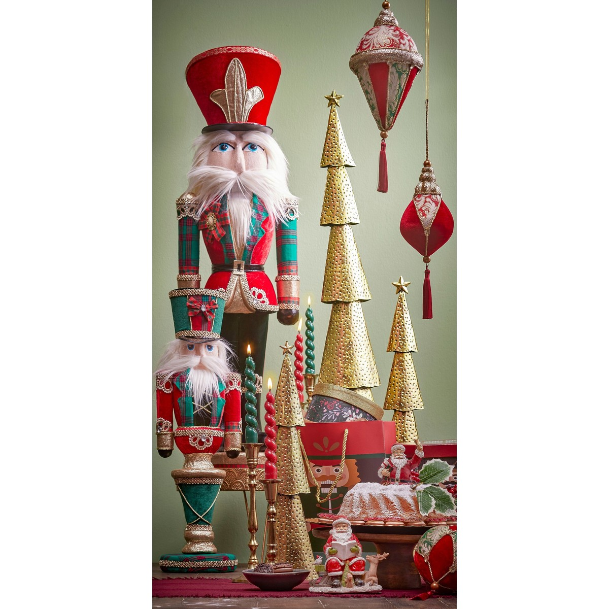 Christmas scene featuring nutcrackers, gold trees, candles, and hanging ornaments against a green background.