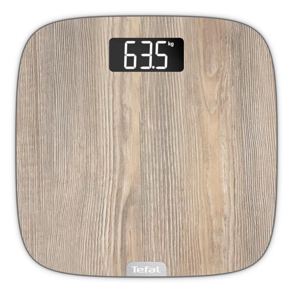 Bilancia pesapersone digitale con finitura in legno, display LCD a 63,5 kg e logo Tefal.