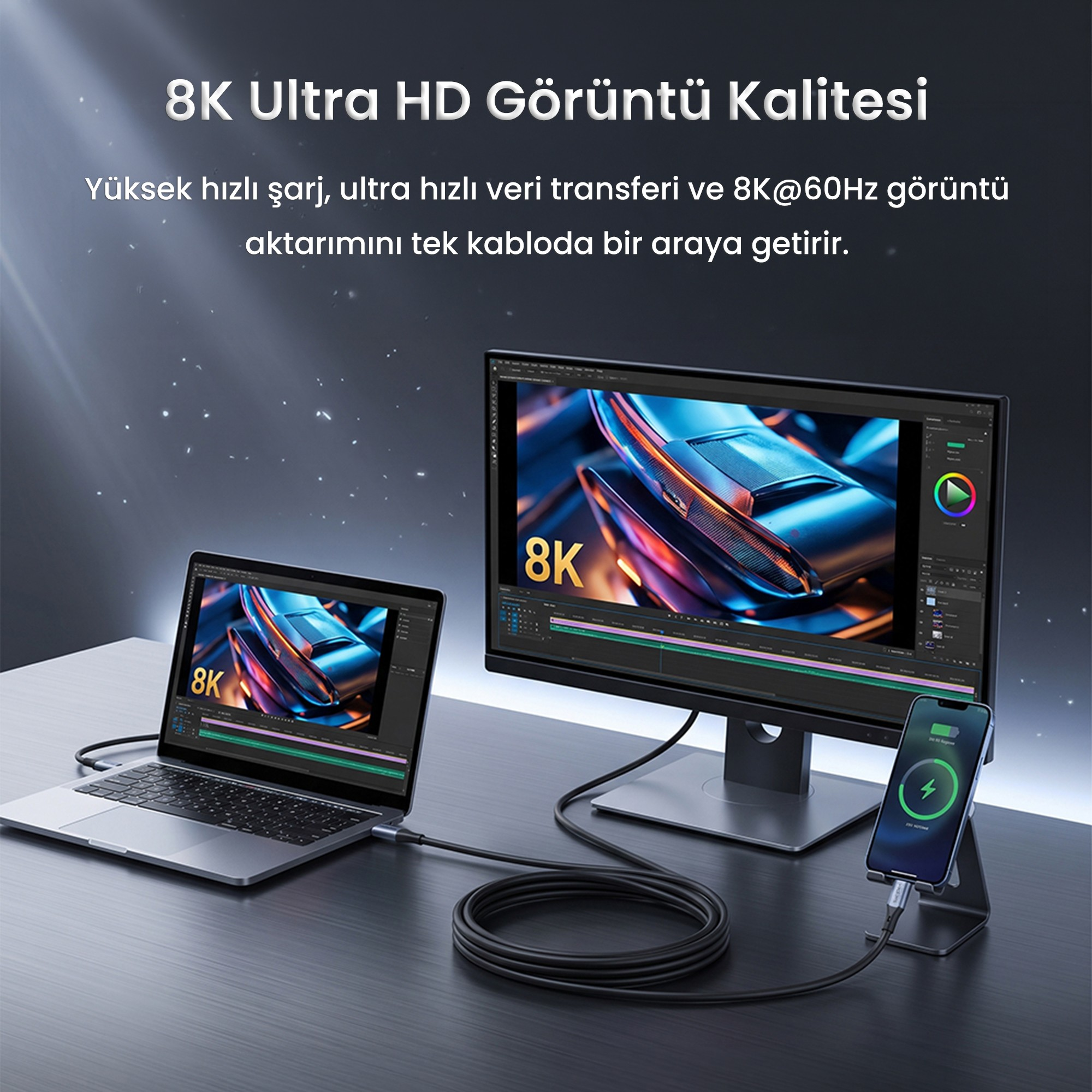 Bir masada kabloyla bağlı bir dizüstü bilgisayar, monitör ve akıllı telefon.