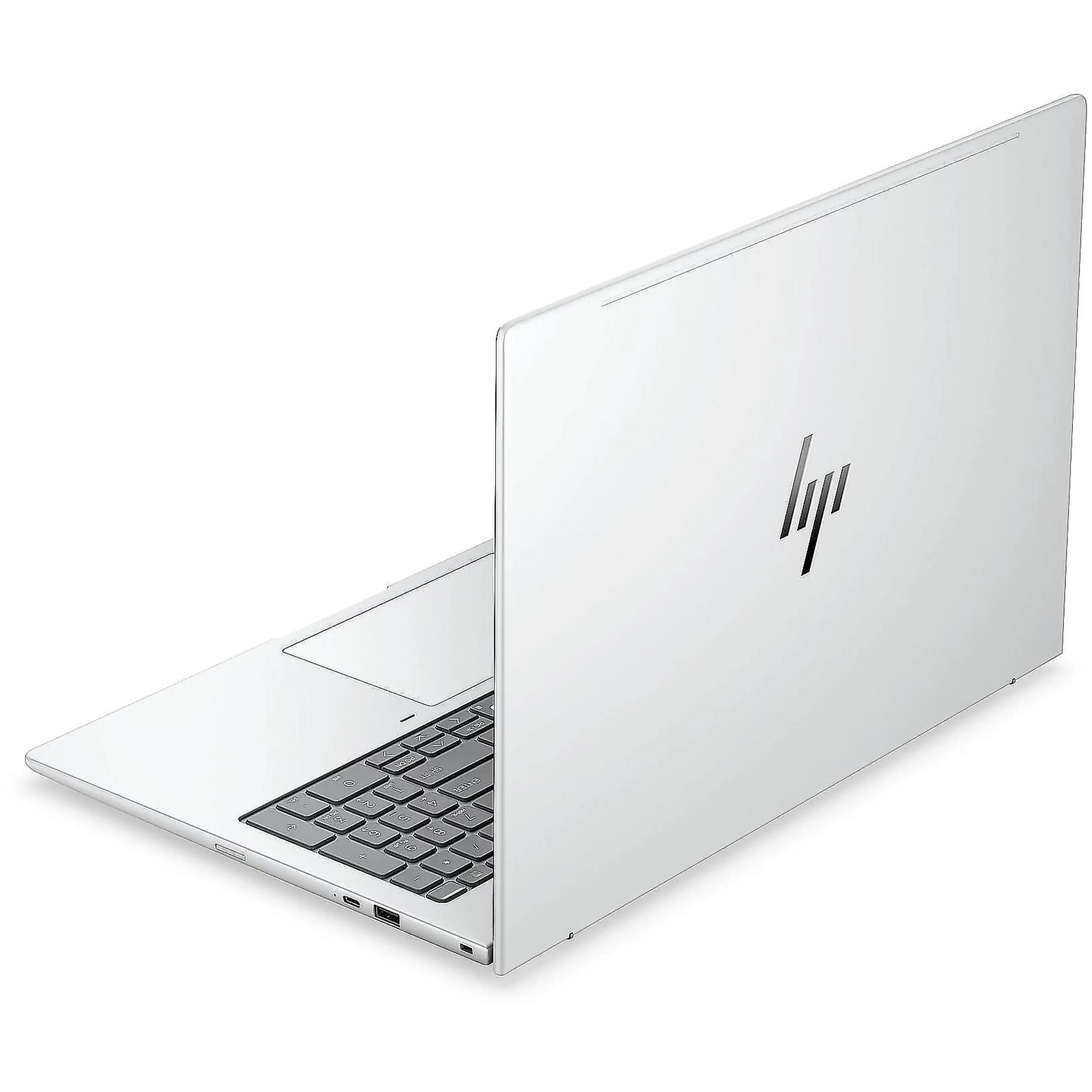Un computer portatile argentato è parzialmente chiuso, mostrando la tastiera e il logo HP.
