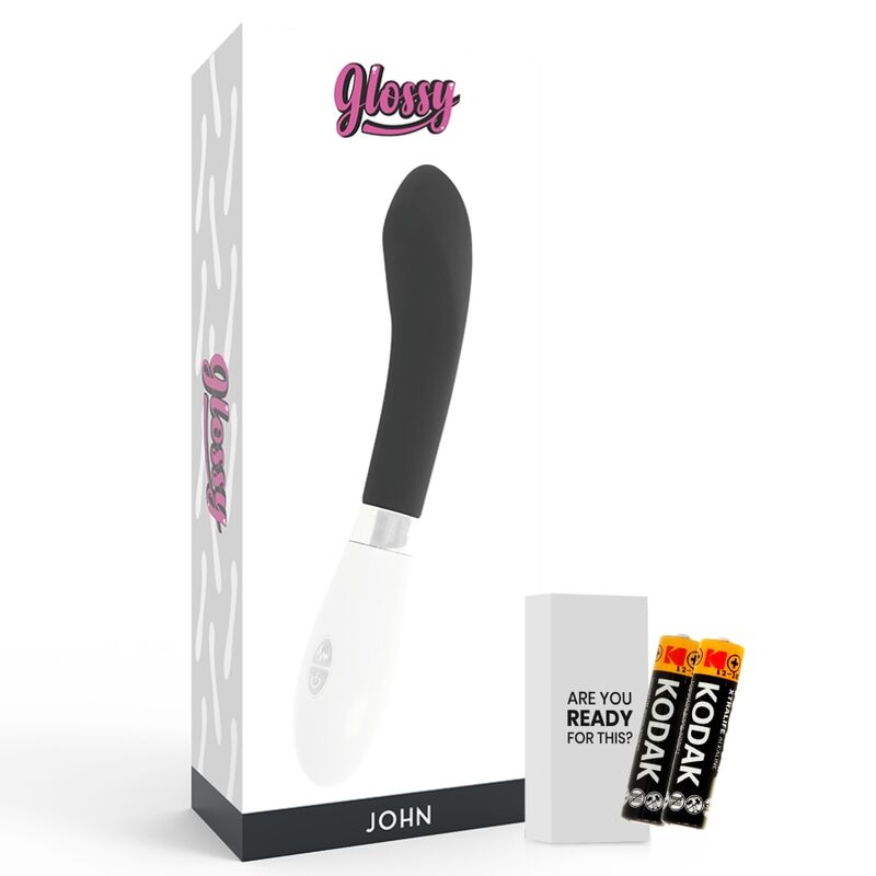 Un vibrador blanco y negro frente a su empaque con las etiquetas "Glossy" y "John", junto a dos pilas.
